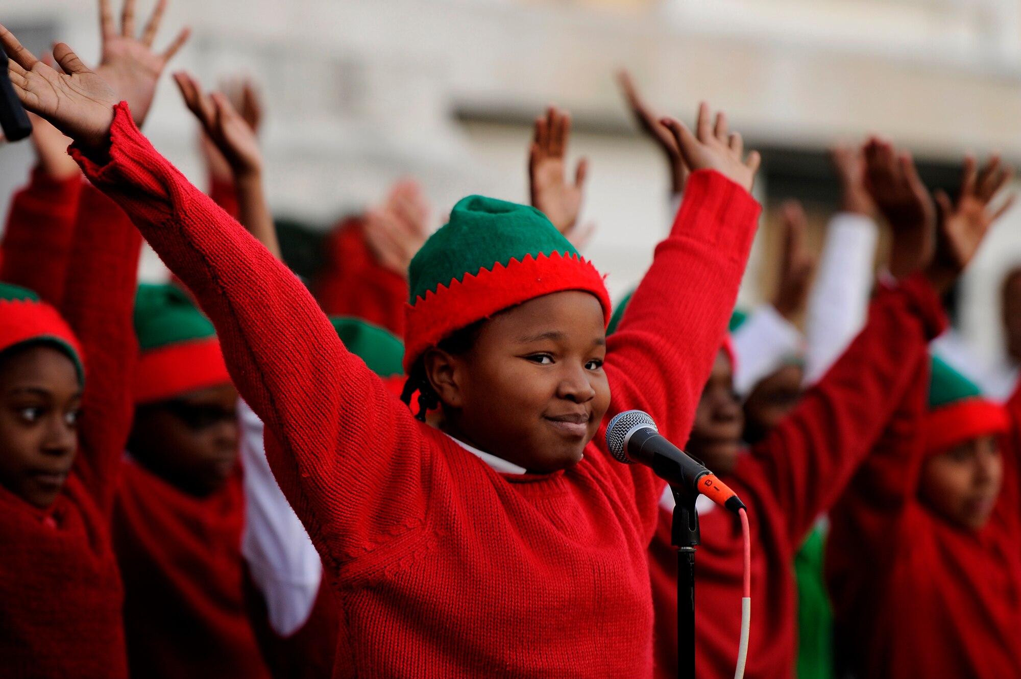 Children from Lemira Elementary School choir, perform in front of the Sumter County Courthouse during the Sumter County Council Christmas Tree Lighting Ceremony, Nov. 30, 2012, Sumter S.C. The annual ceremony brought about the holiday spirit as several elementary, junior high, and high school choirs performed Christmas carols for those who gathered at the courthouse to witness the celebration. (U.S. Air Force photo by Staff Sgt. Kenny Holston/Released)