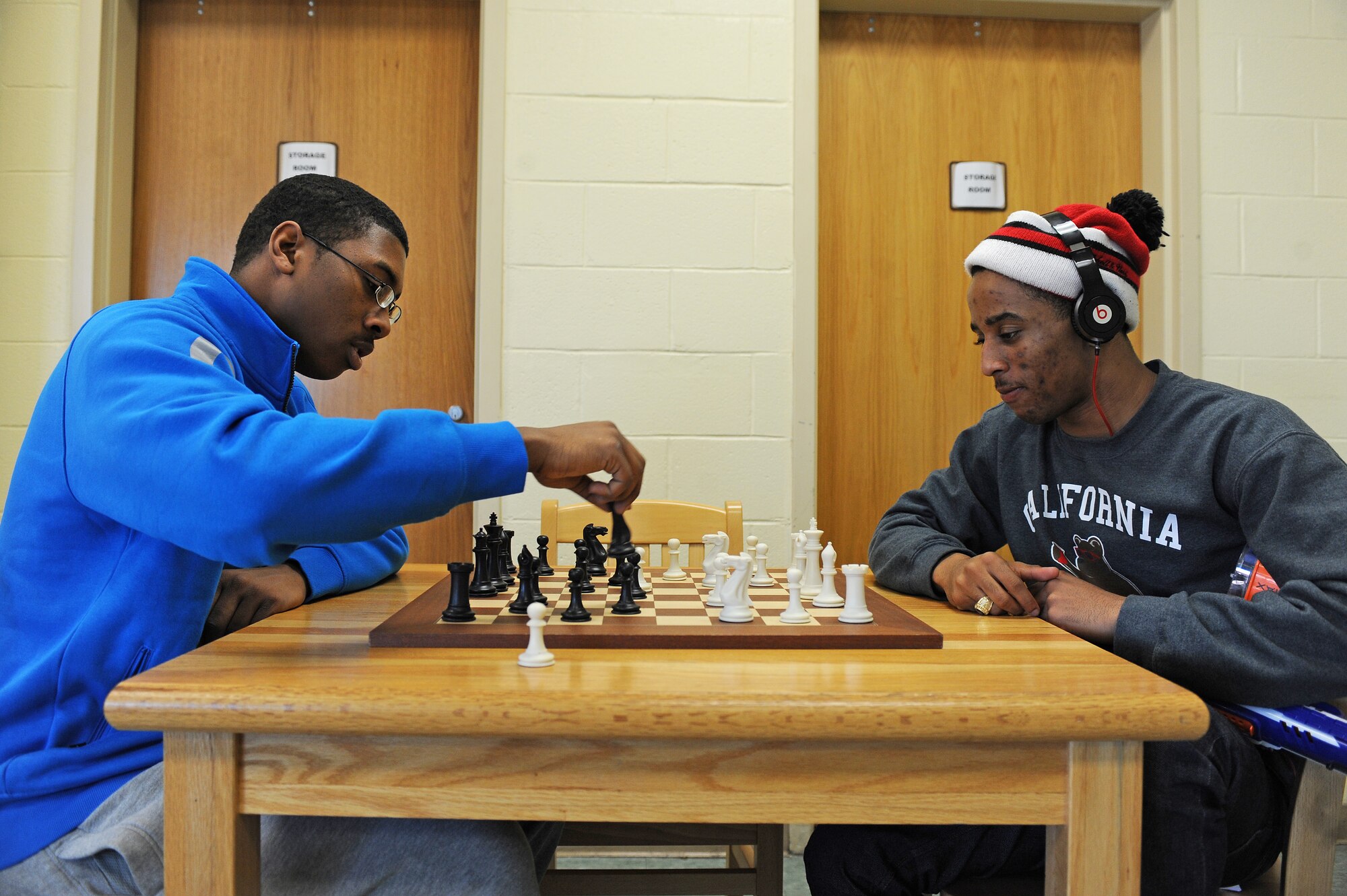 U.S. Air Force Airmen 1st Class Shuntarrius Funchess (left) and Frank Gary, 4th Force Support Squadron services apprentices, play a game of chess at the Airman’s Center on Seymour Johnson Air Force Base, N.C., Dec. 1, 2012. Board games such as Monopoly, Checkers and Chess are available for patrons to play. (U.S. Air Force photo/Airman 1st Class John Nieves Camacho/Released)