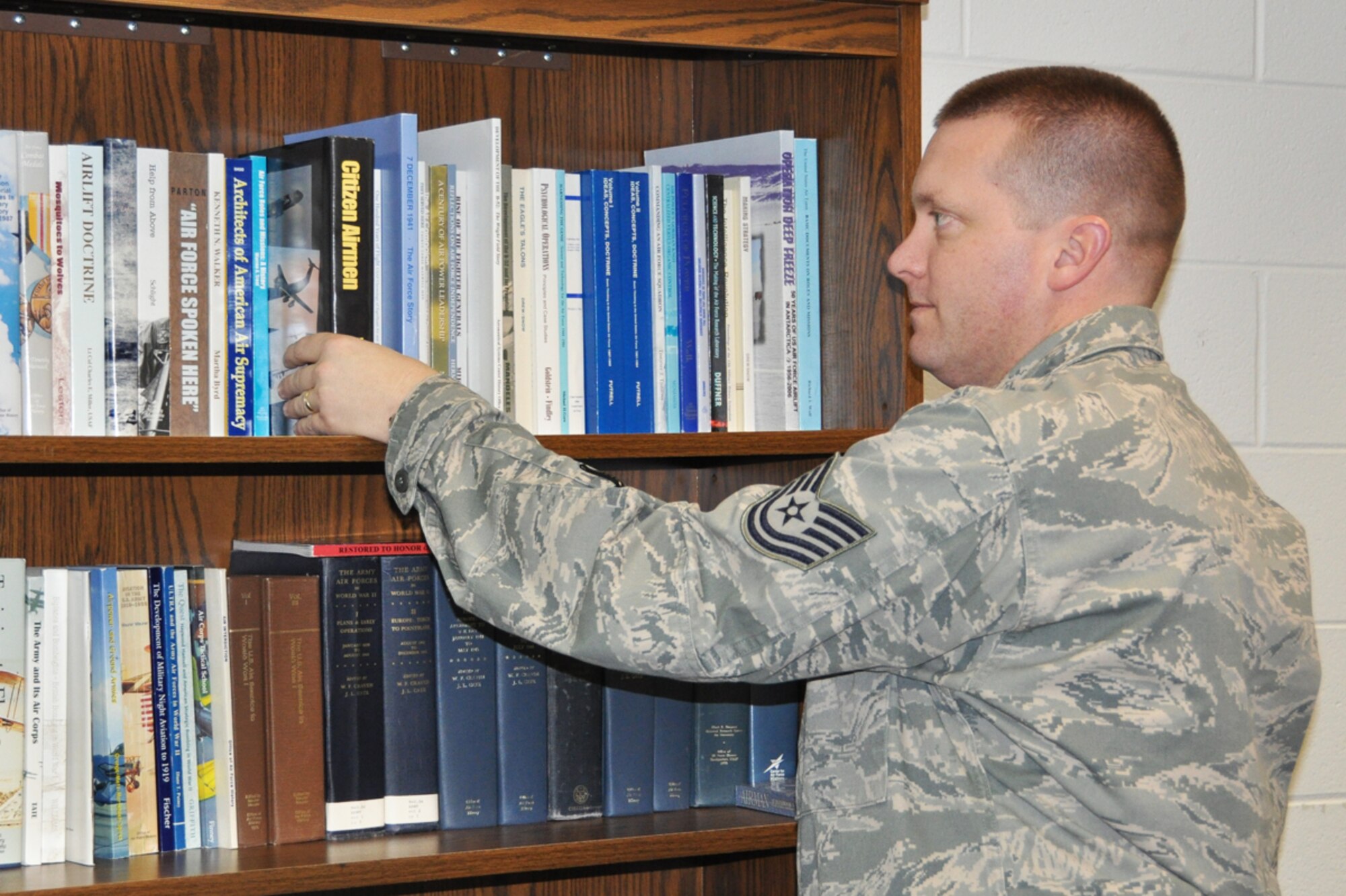 Tech. Sgt. Jason Paseur is the 94th Airlift Wing historian. His primary duty is to complete an annual wing history report, house and archive historical documents and photographs related to the wing and base, provide research assistance and fulfill requests for historical base information. (U.S. Air Force photo/James Branch)

