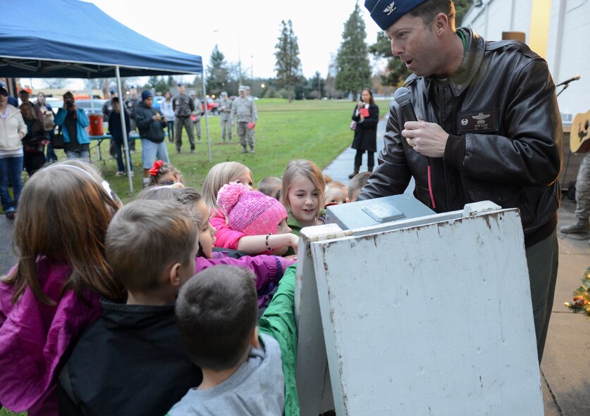 Col. Wyn Elder, 62nd Airlift Wing commander, gets help from some eager children to countdown the annual McChord Tree Lighting ceremony, Dec. 3, 2012, at Joint Base Lewis-McChord, Wash. After a short countdown, Elder and the children pulled a switch to light the tree located behind the Chapel Annex on Col. Joe Jackson Blvd. (U.S. Air Force photo/Staff Sgt. Sean Tobin)