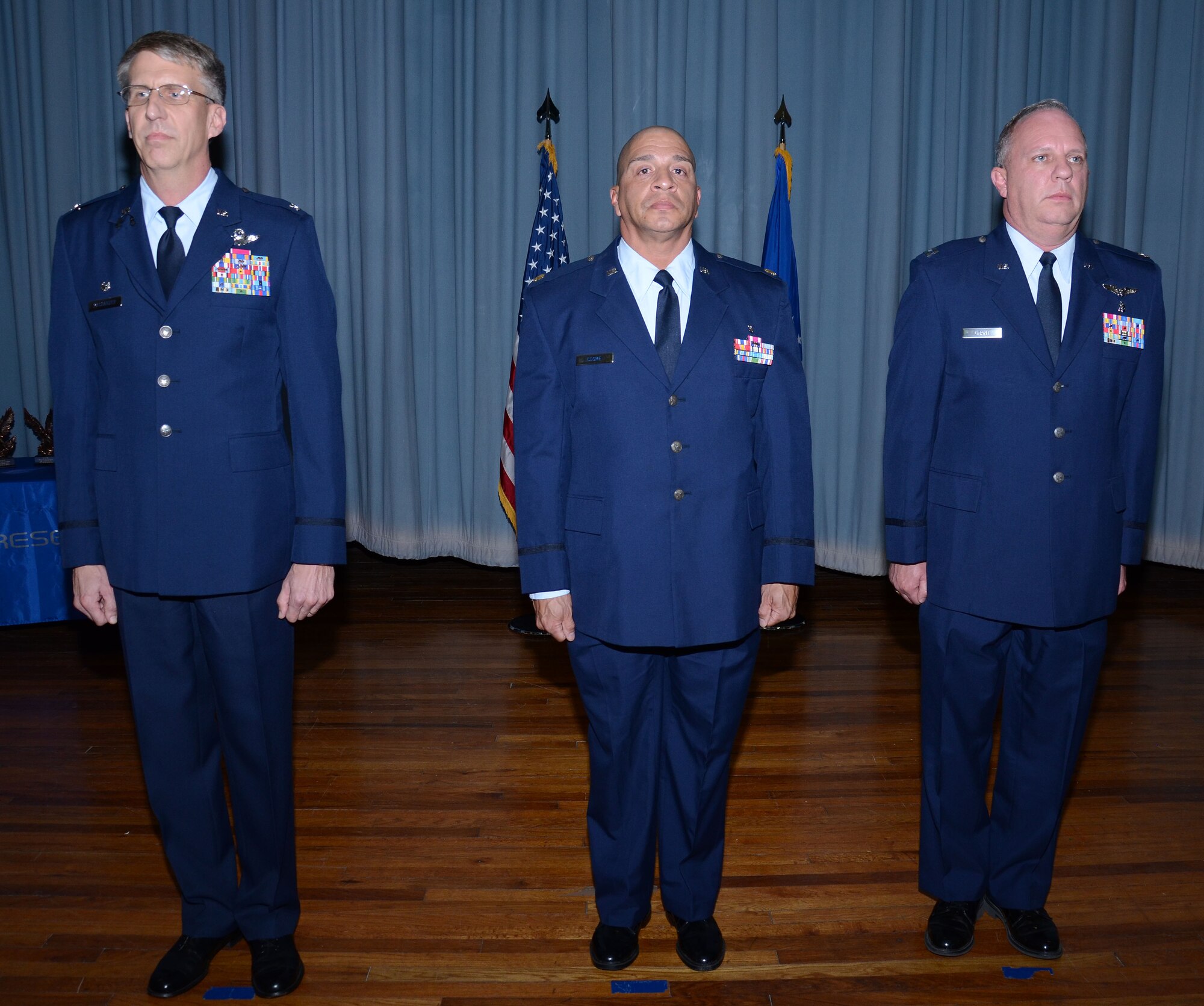 Col. Jeffery Macrander, 920th Rescue Wing commander, stands with Meritorious Service Medal winners  Maj. Ralph Cosme and Capt. James Grant, both from 920th RQW Aeromedical Staging Squadron during Sunday's Unit Training Assembly. Cosme and Grant were recognized for their medical work while deployed downrange. (U.S. Air Force photo/Staff Sgt. Anna-Marie Wyant)