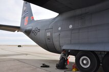 Senior Airman Dominic Navarro, 302nd Aircraft Maintenance Squadron, performs routine maintenance on aircraft 94-7320 Nov. 2. The aircraft is the latest black letter C-130 Hercules achieved by the Airmen of the 302nd Maintenance Group.