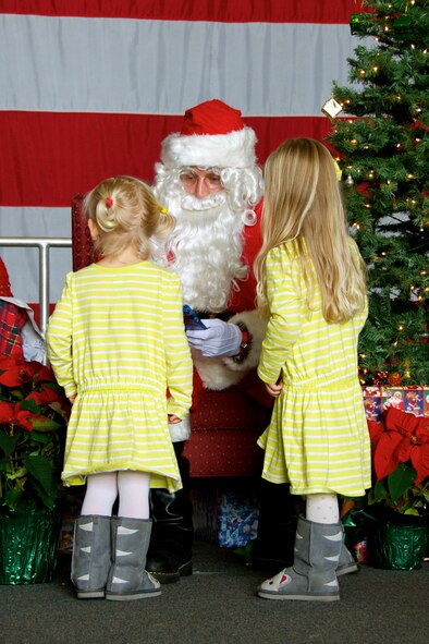 Children met Santa and were given books at the 20th Operations Group Children's Holiday Party, Shaw Air Force Base, S.C. Dec. 1, 2012. (U.S. Air Force photo by Capt. Ann Blodzinski/ Released)