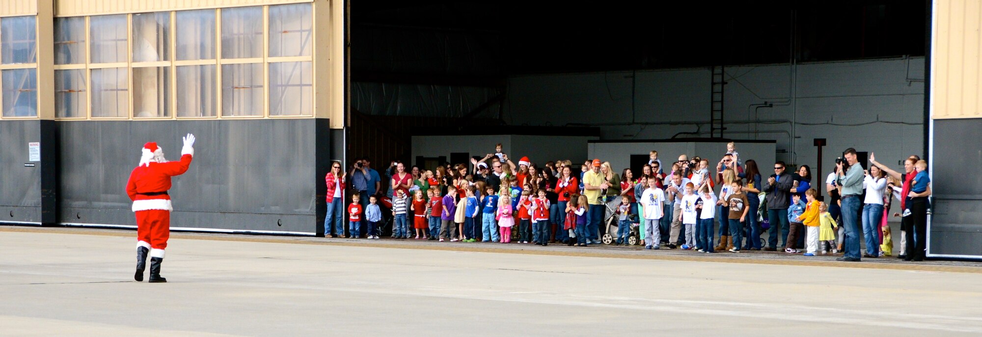 Santa waves to the children of Shaw after arriving in an U.S. Air Force F-16 Fighting Falcon for the 20th Operations Group Children's Holiday Party, Shaw Air Force Base, S.C. Dec. 1, 2012. (U.S. Air Force photo by Capt. Ann Blodzinski/ Released)