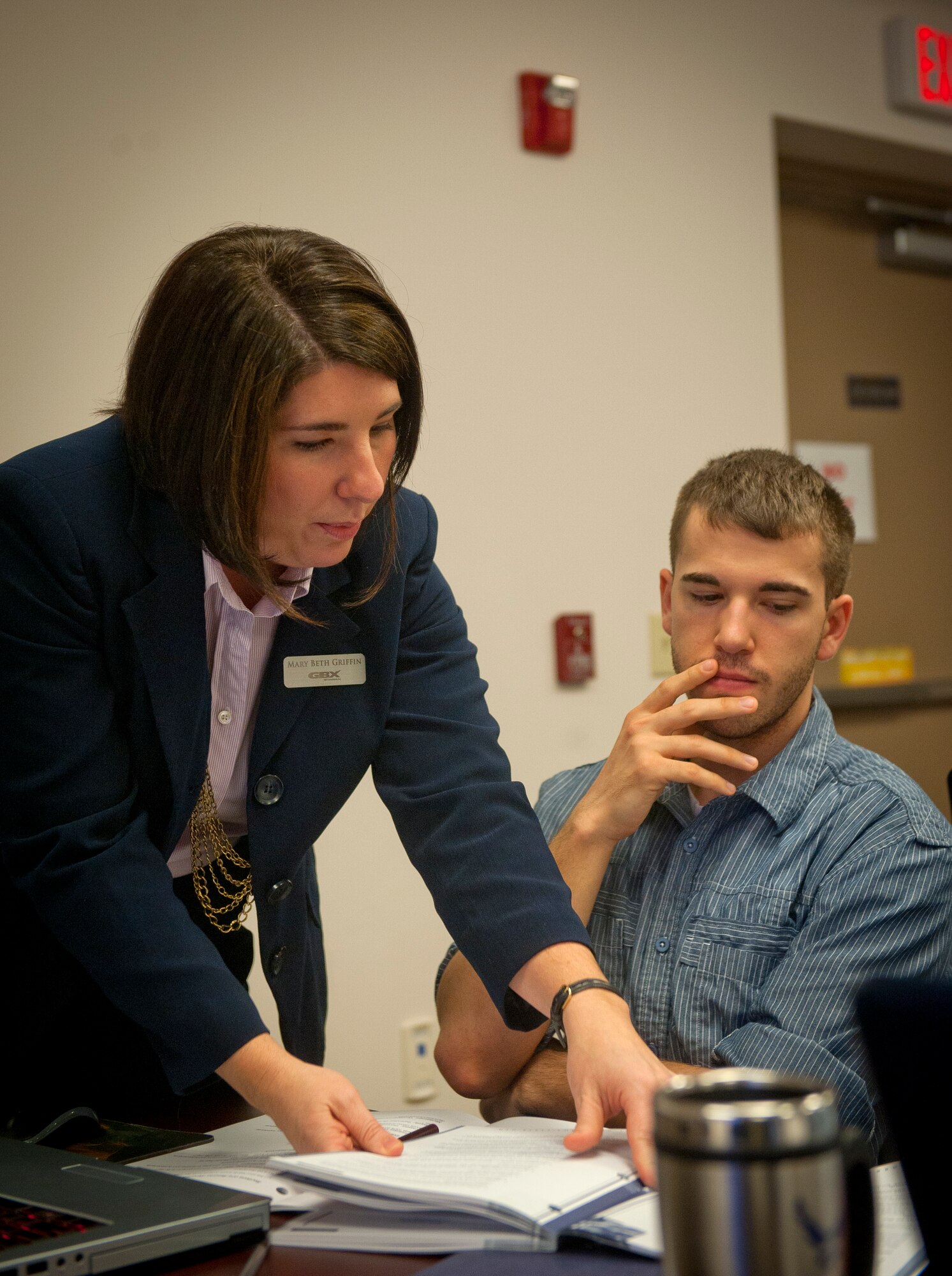Mary Beth Griffin, GBX Consultants Transition Assistance facilitator, helps U.S. Air Force Senior Airman Nicholas Benroth, 23d Wing Public Affairs Community Relations journeyman, with writing a resume during a TAP class at Moody Air Force Base, Ga., Nov. 28, 2012. At the beginning of the course, students chose between education, entrepreneurial, technical or employment as their career path, and they received instruction based on that path. (U.S. Air Force photo by Airman 1st Class Jarrod Grammel/Released)
