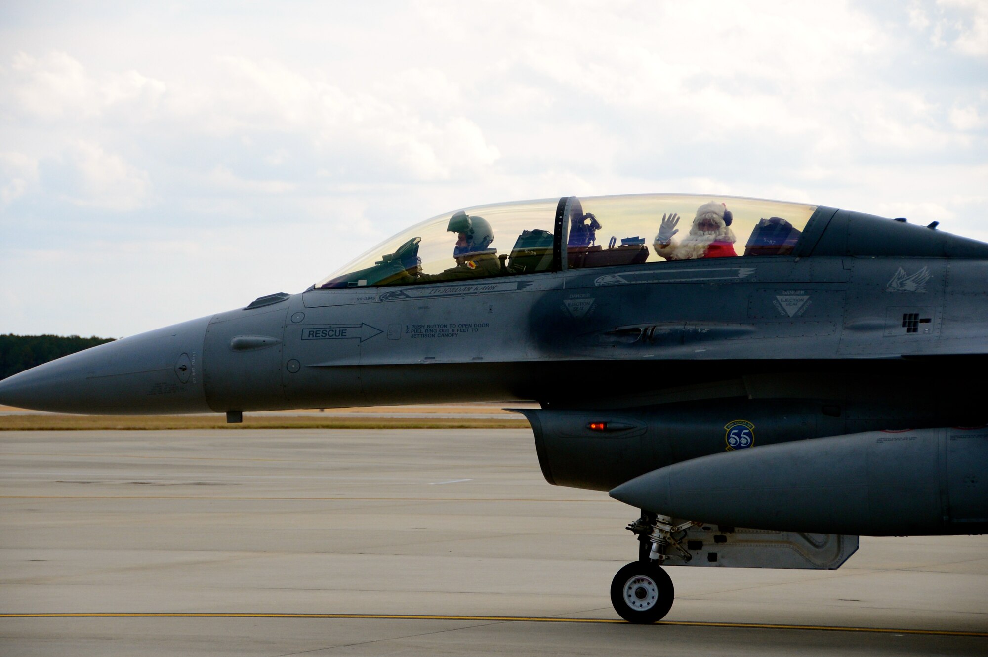 U.S. Air Force Lt. Col. Jared Hutchinson, 55th Fighter Squadron director of operations, sits in a F-16 Fighting Falcon after flying Santa to Shaw for the 20th Operations Group Children's Holiday Party, Shaw Air Force Base, S.C. Dec. 1, 2012. (U.S. Air Force photo by Capt. Ann Blodzinski/ Released)