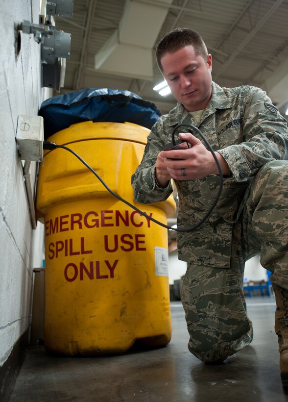 Staff Sgt. Joel Nobles, 28th Bomb Wing Staff ground safety technician, uses a polarity tester to ensure outlets will trip when necessary at Ellsworth Air Force Base, S.D., Nov. 29, 2012. The 28th Bomb Wing ground safety personnel perform unannounced spot inspections randomly among the wing once a week to ensure sections are in compliance with safety regulations. (U.S. Air Force photo by Airman 1st Class Alystria Maurer/Released)