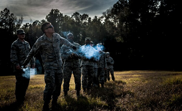 Staff Sgt. David Alderete, 1st Combat Camera Squadron maintenance, prepares to throw a Ground Burst Simulator grenade into a ditch during Combat Readiness Training with the 628th Explosive Ordnance Squadron Nov. 30, 2012, at Joint Base Charleston – Air Base, S.C. Airmen attended an hour-long class to review safety procedures when handling grenades. (U.S. Air Force photo/ Senior Airman Dennis Sloan)