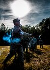 Tech. Sgt. Frederick Sheppard, 1st Combat Camera Squadron noncommissioned officer in charge of supply, throws a Ground Burst Simulator grenade into a ditch during Combat Readiness Training with the 628th Explosive Ordnance Squadron Nov. 30, 2012, at Joint Base Charleston, S.C. Airmen attended an hour-long class to review safety procedures when handling grenades. (U.S. Air Force photo/ Senior Airman Dennis Sloan)
