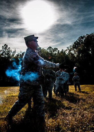 Tech. Sgt. Frederick Sheppard, 1st Combat Camera Squadron noncommissioned officer in charge of supply, throws a Ground Burst Simulator grenade into a ditch during Combat Readiness Training with the 628th Explosive Ordnance Squadron Nov. 30, 2012, at Joint Base Charleston, S.C. Airmen attended an hour-long class to review safety procedures when handling grenades. (U.S. Air Force photo/ Senior Airman Dennis Sloan)