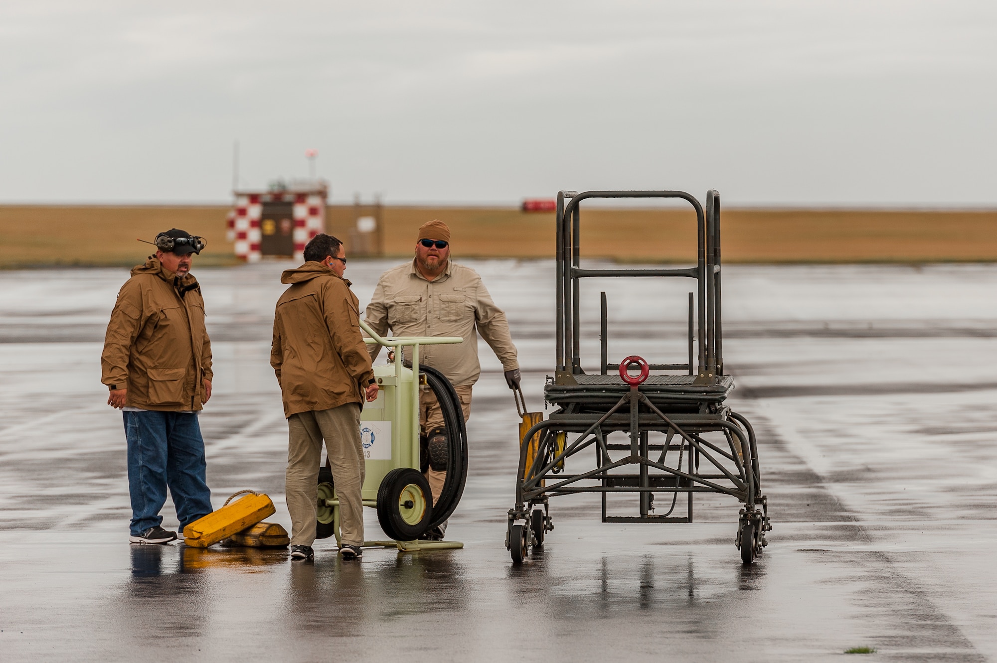 NASA's WB-57F Canberra crewmembers prepares the taxi way for the landing of the WB -57F at Lajes Field Dec. 3. The WB-57F visited for a refueling mission as it headed back to its home base at Ellington Field near the NASA Johnson Space Center in Houston, Texas, Dec. 3. There are only two fully operational WB-57 aircraft in the world. Both have been flying research missions since the early 1960's.  (Photos by Lucas Silva)