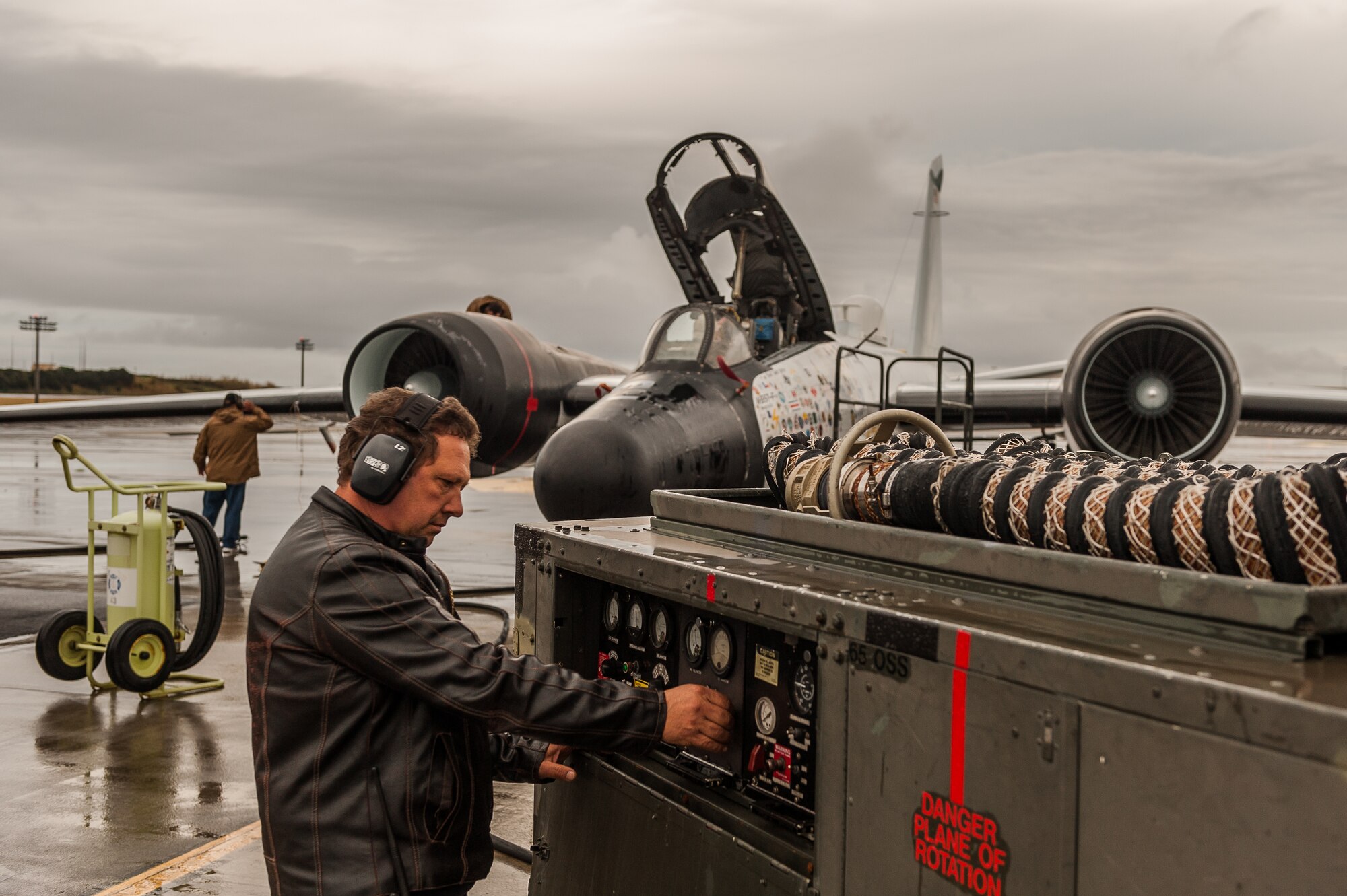 Francisco Augusto, 65th Operations Support Squadron Aerospace Ground Equipment, checks the Dash 60 Generator power output for the WB-57F Canberra while providing airplane power support Dec. 3. The WB-57 provides unique, high-altitude airborne platforms to U.S. government agencies, academic institutions, and commercial customers in order to support scientific research and advanced technology development and testing at locations around the world. (Photos by Lucas Silva)