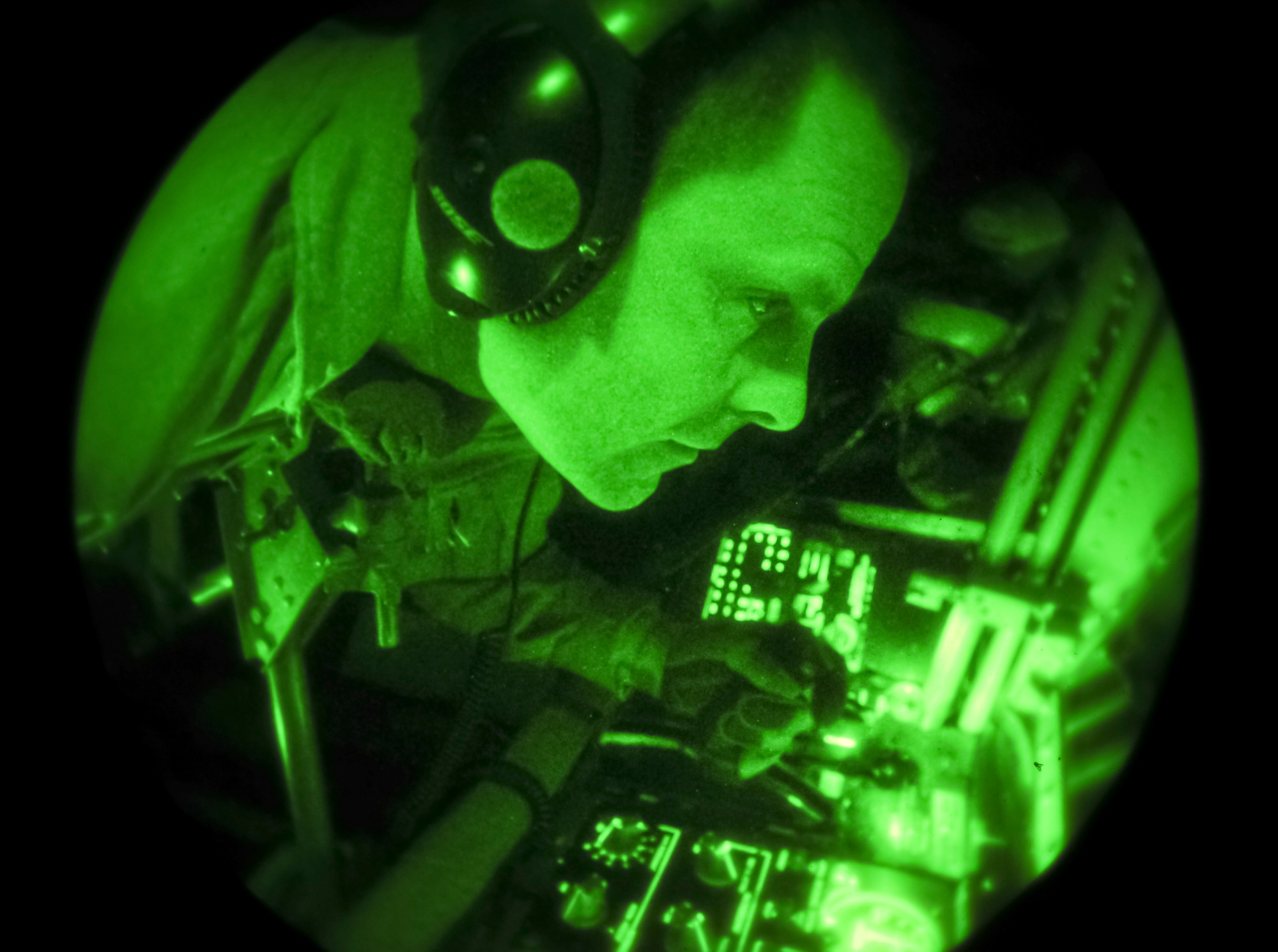 Master Sgt. Ted Buit refuels a C-17 Globemaster III from the 62nd Air Mobility Wing at Joint Base Lewis-McChord, Wash., from the boom pod of a 92nd Air Refueling Squadron KC-135 Stratotanker over Washington and Oregon, Nov. 15, 2012. Buit is the 92nd Operations Group standards evaluations NCO in charge and career boom operator. On this flight he surpassed 7,500 mishap free flying hours. (U.S. Air Force photo by Senior Airman Benjamin Stratton)