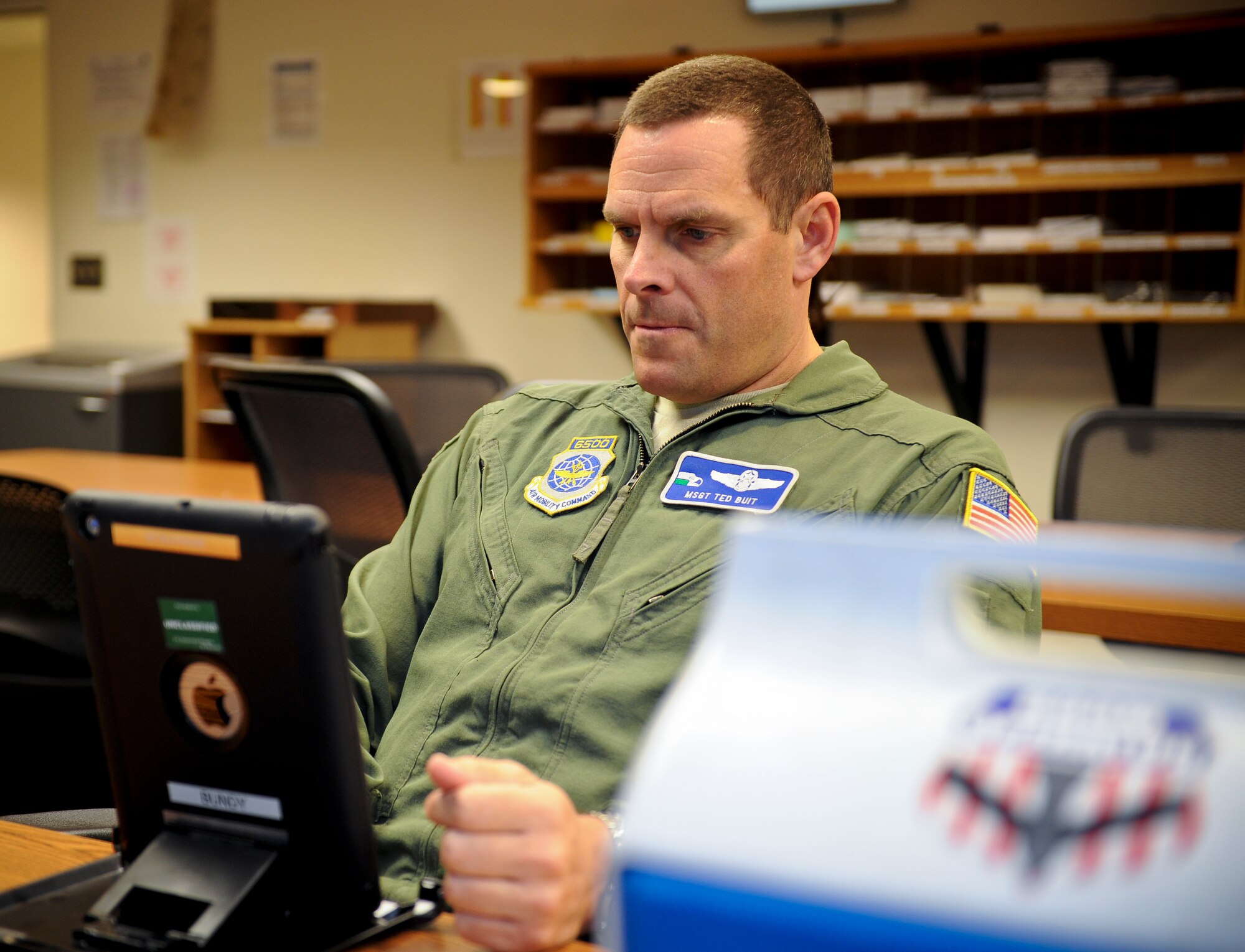 Master Sgt. Ted Buit reviews technical orders for an upcoming operation in base operations at Fairchild Air Force Base, Wash., Nov. 15, 2012. Buit is the 92nd Operations Group standards evaluations NCO in charge and career boom operator. On this flight he surpassed 7,500 mishap free flying hours. (U.S. Air Force photo by Senior Airman Benjamin Stratton)