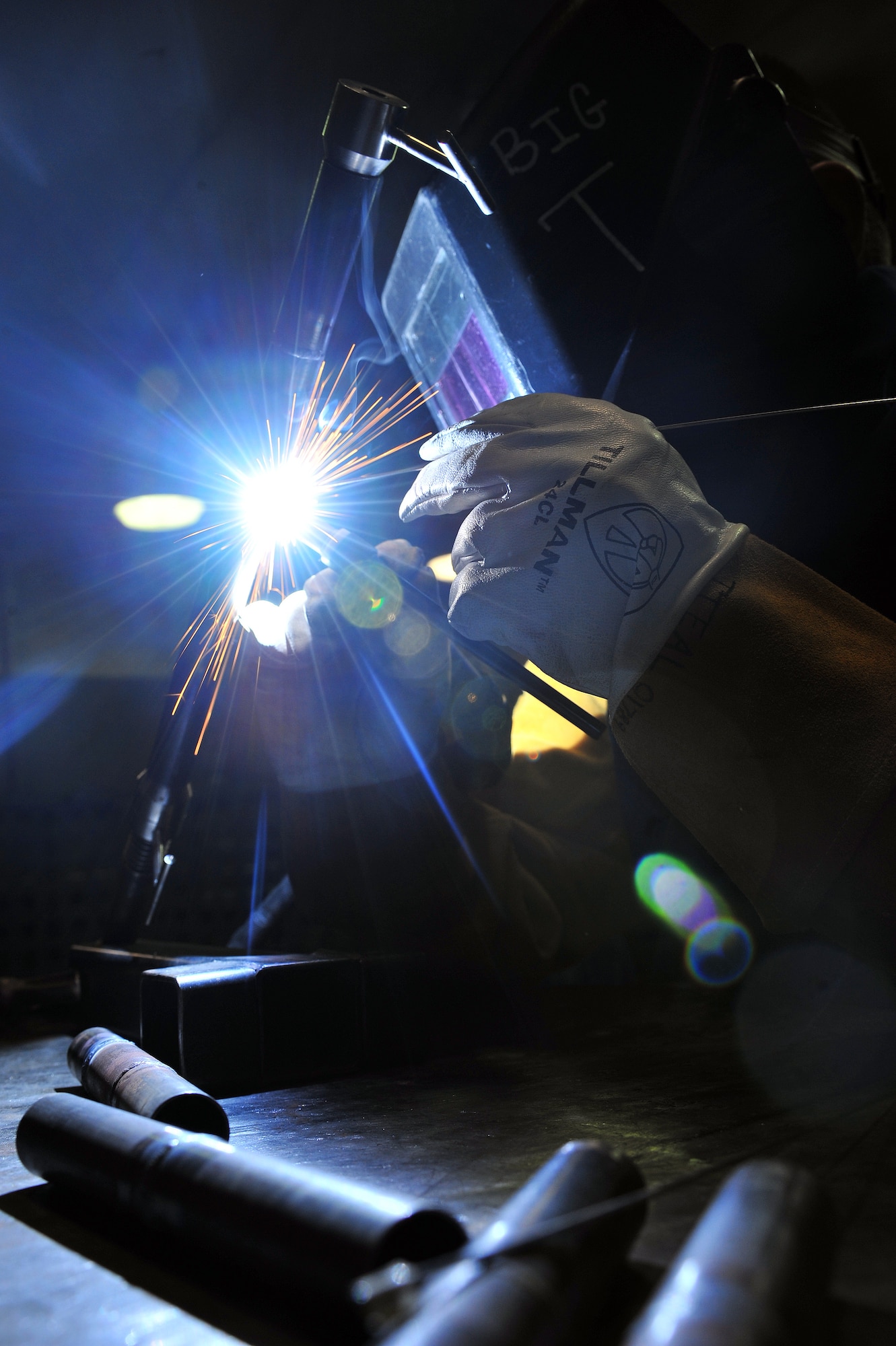 U.S. Air Force Airman 1st Class Donovan Timek, 355th Equipment Maintenance Squadron aircraft metals technology journeyman, is tungsten inert gas arc welding in the G6 position on Davis-Monthan Air Force Base, Ariz., Nov 27, 2012.  Airman Timek is practicing this technique to be weld certified in Air Force Metals Tech Standards. (U.S. Air Force Photo by Airman 1st Class Josh Slavin/Released)