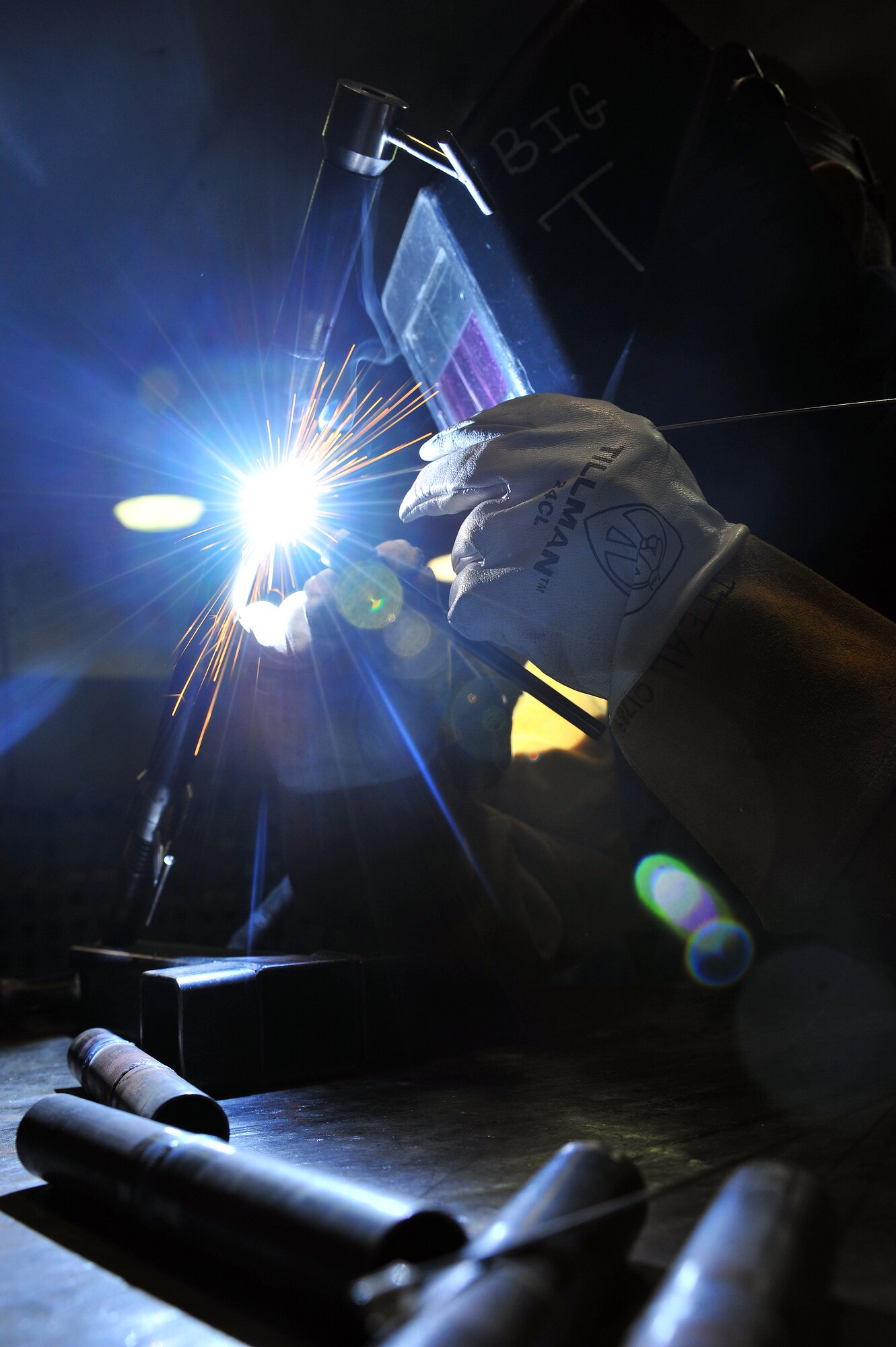 U.S. Air Force Airman 1st Class Donovan Timek, 355th Equipment Maintenance Squadron aircraft metals technology journeyman, is tungsten inert gas arc welding in the G6 position on Davis-Monthan Air Force Base, Ariz., Nov 27, 2012.  Airman Timek is practicing this technique to be weld certified in Air Force Metals Tech Standards. (U.S. Air Force Photo by Airman 1st Class Josh Slavin/Released)