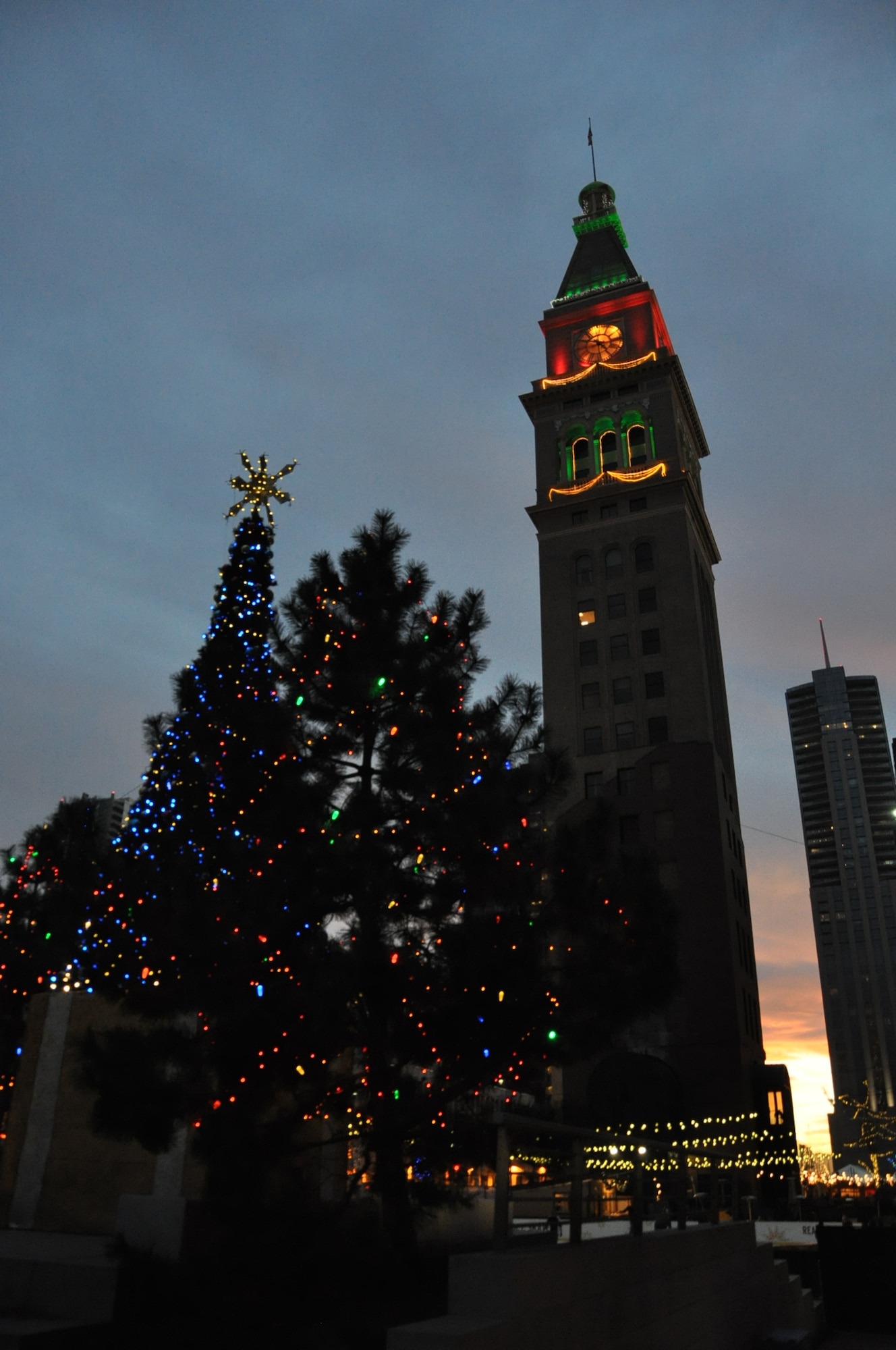 DENVER – Skyline Park trees and the Fisher Clock Tower are festively lit Nov. 28, 2012, at the 12th annual Denver Christkindl Market in Skyline Park. The market is the production of the German Cultural Foundation of the Rocky Mountains and the German American Chamber of Commerce – Colorado Chapter. The Christkindl Market will be located on the corners of 16th and Arapahoe Streets through Dec. 22. (U.S. Air Force photo by Staff Sgt. Kali L. Gradishar)