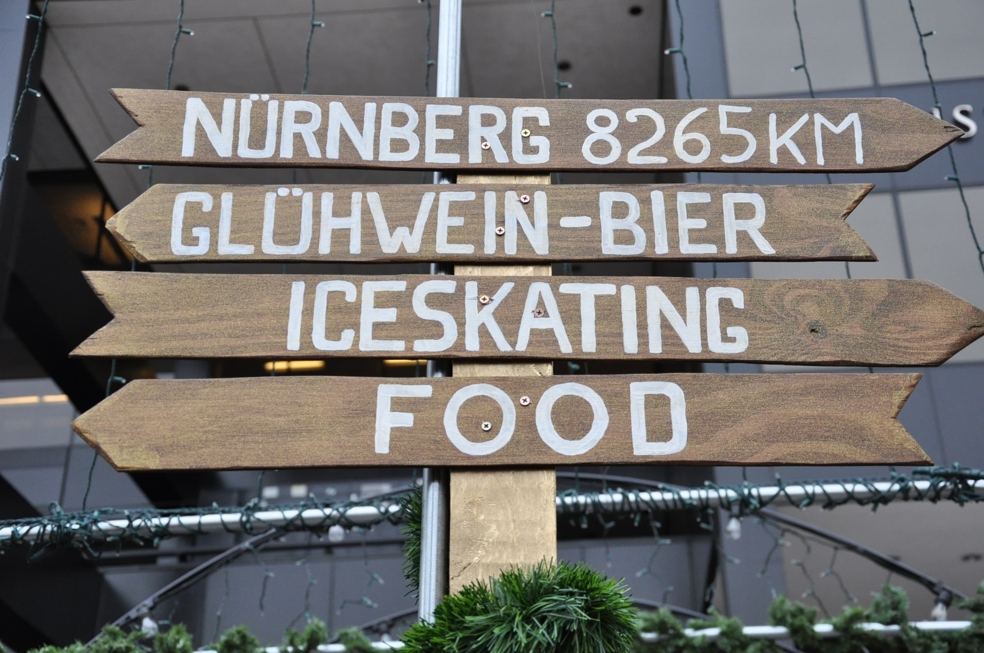 DENVER – A directional sign points people in the direction of drinks, ice skating, food and Nurnberg, Germany, Nov. 28, 2012, at the 12th annual Denver Christkindl Market scheduled to run through Dec. 22 in Skyline Park. From ice skating to traditional German cuisine, the market offers an abundance of activities and sights for those looking for something to do. (U.S. Air Force photo by Staff Sgt. Kali L. Gradishar)
