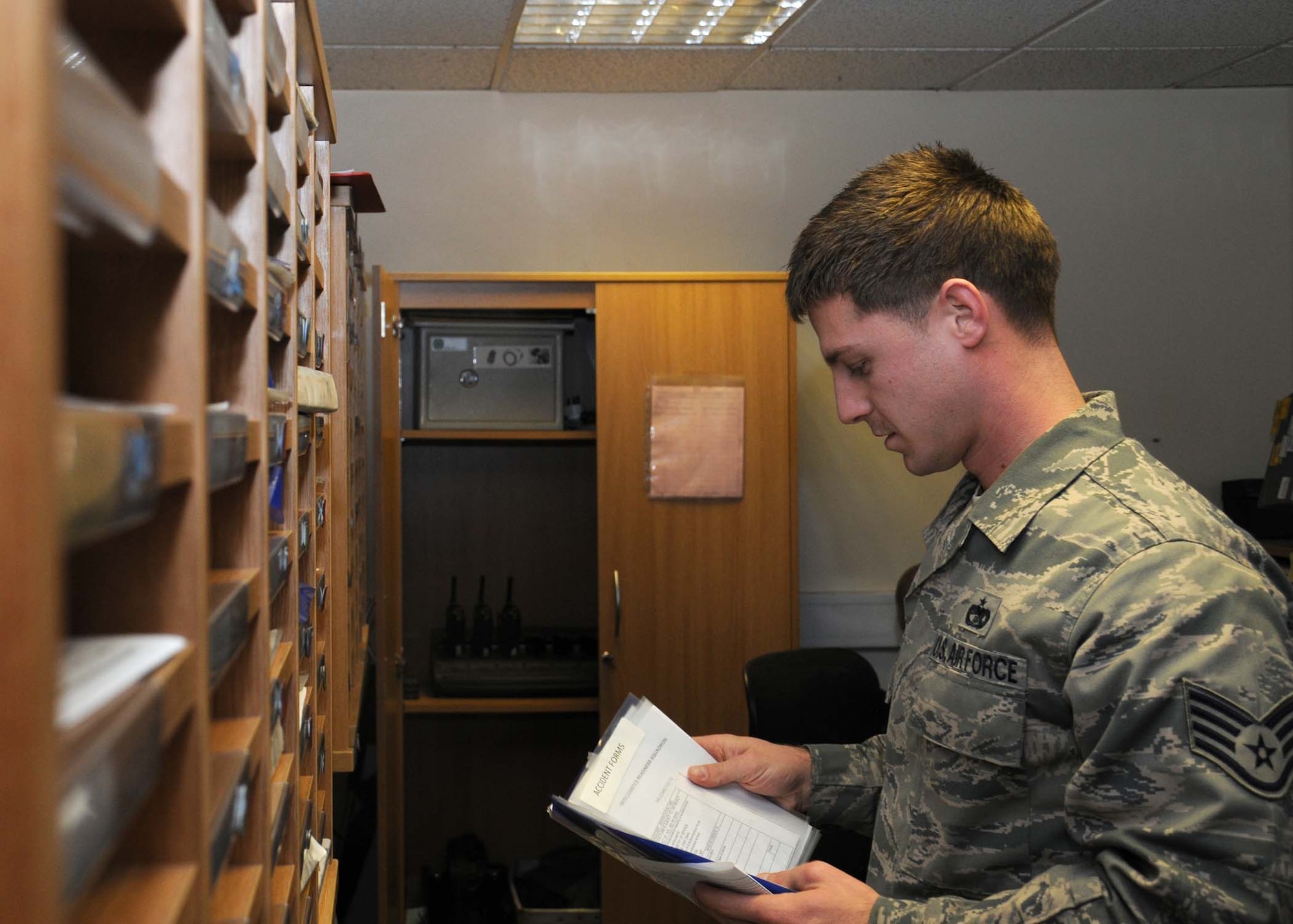 Staff Sgt. Jared Payne, 100th Logistics Readiness Squadron vehicle dispatcher from Columbus, Ga., performs a vehicle paperwork inspection Dec. 4, 2012, at RAF Mildenhall, England. Each vehicle within the section is checked every four days to ensure proper documentation. (U.S Air Force photo by Gina Randall/Released)
