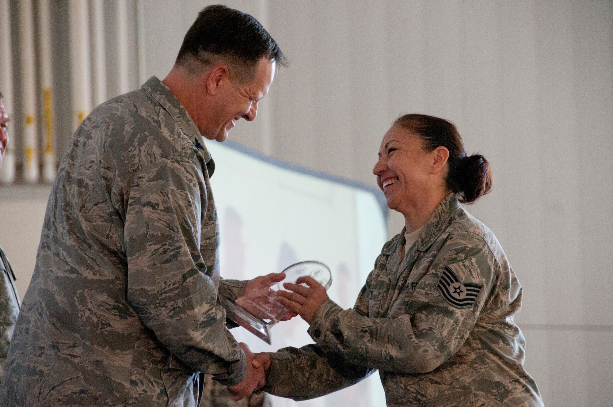 Tech. Sgt. Irasema Perry, contracting officer representative for the 162nd Fighter Wing, is awarded NCO of the Year by Col. Michael McGuire, 162nd Fighter Wing commander, Nov. 3 during the wing’s annual awards ceremony. U.S Air Force Photo by Tech. Sgt. Hollie Hansen. 