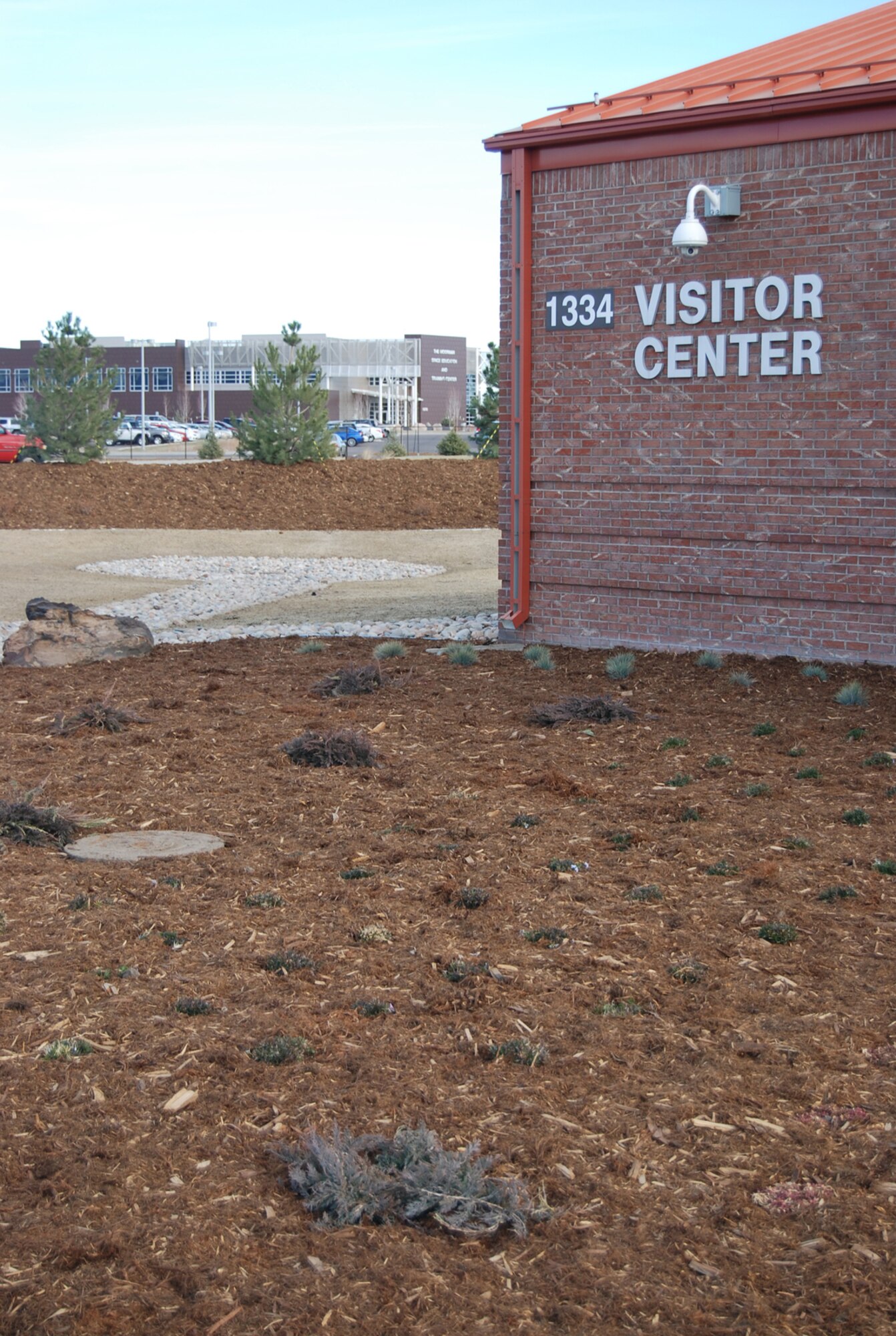 A mixture of mulch, rock and native grasses are being installed around the west gate visitors center as part of a xeriscaping project to remove 40 percent of the Kentucky Bluegrass there. The low water vegetation will reduce water usage in the area by 30 percent or 1.3 million gallons annually and is part of the wing’s continuing focus on resource conservation. (U.S. Air Force photo)