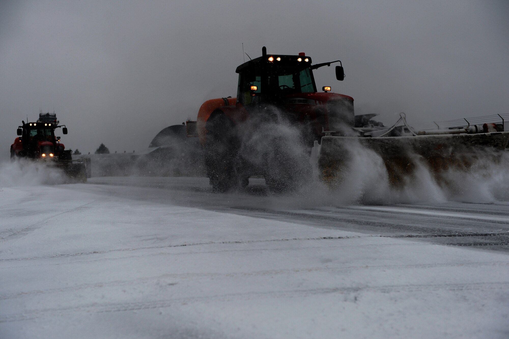 SPANGDAHLEM AIR BASE, Germany – An Airman from the 52nd Civil Engineer Squadron pavement maintenance and heavy equipment shop uses a snow broom vehicle to clear snow and ice from the airfield taxiway Dec. 3, 2012. The shop has more than 60 Airmen and 25 vehicles capable of clearing snow and ice from base roads and the airfield. (U.S. Air Force photo by Airman 1st Class Dillon Davis/Released)