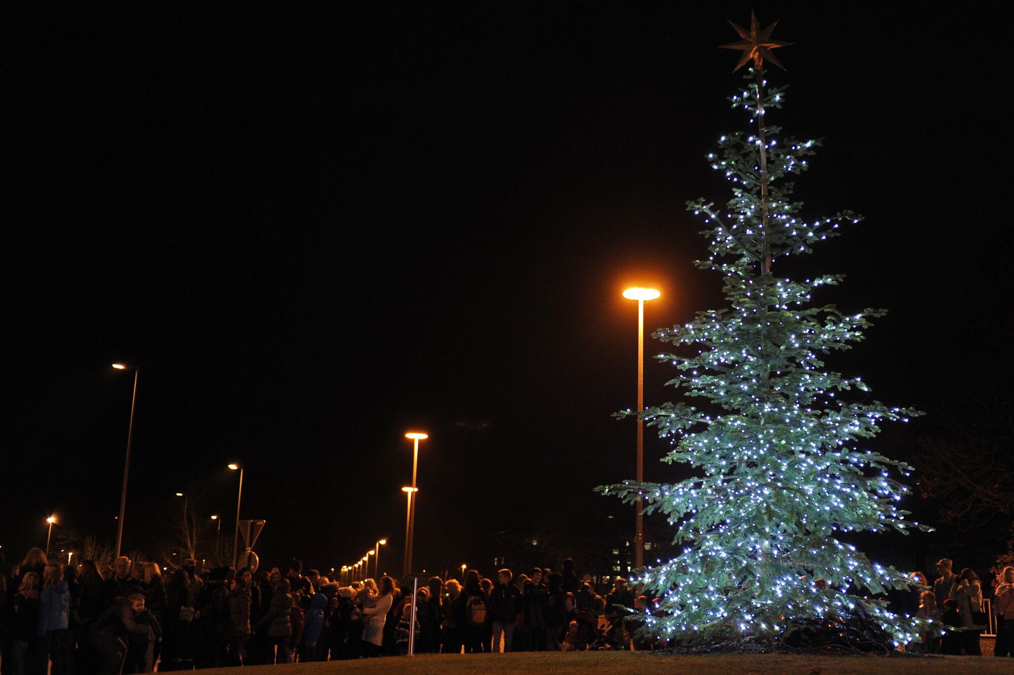 Kaiserslautern Military Community members witness the lighting of the Christmas tree on Ramstein Air Base Nov. 28, 2012. The ceremony included seasonal music, the tree lighting and photos with Santa. (U.S. Air Force photo/Airman 1st Class Holly Cook)