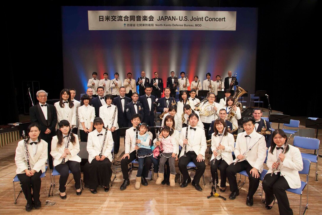 MUSASHIMURAYAMA, Japan -- Pacific Showcase, Band of the Pacific-Asia’s jazz ensemble, poses with the Musashimurayama Wind Ensemble following the Japan-US Joint Concert on at Musashimurayama Public Hall, Musashimurayama City, Japan on Dec. 2, 2012.  The bilateral performance represented the friendship and camaraderie between the US and Japan. (Courtesy photo by “Photo Linkage” company.)