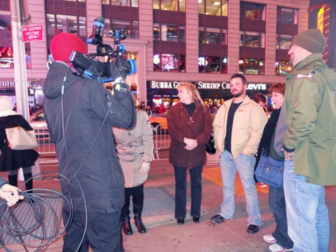 A German television broadcast crew interviews members of the Tulsa District Power Planning and Response Team election night, Nov. 6, in New York City. The team had just wrapped up their duty day, gotten dinner and was on their way back to their hotel when they were stopped by the German crew for an interview about the election. Pictured from left to right is Nancy Crenshaw, mission specialist, Shaun Wenzel, quality assurance, Brande Serner, mission liaison, and BJ Parkey, mission manager.