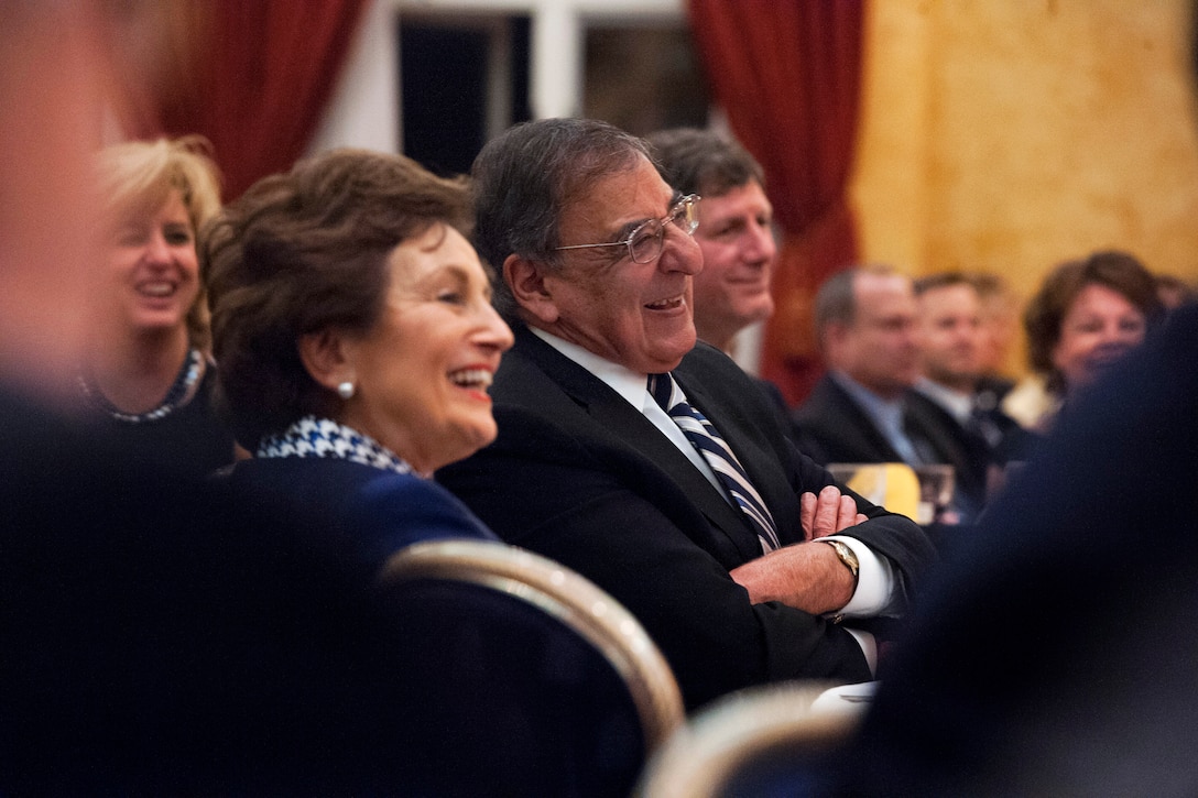 Defense Secretary Leon E. Panetta, and his wife, Sylvia, laugh as he is introduced at the Undersecretary of Defense for Intelligence 10th anniversary celebration dinner on Joint Base Myer-Henderson Hall in Arlington, Va., Dec. 3, 2012.