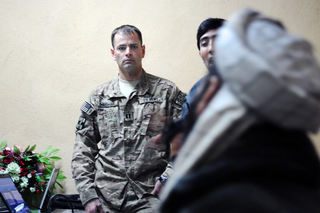 U.S. Army Capt. Shawn Basinger observes training with local Afghans in Farah City in Afghanistan's Farah province, Dec. 1, 2012. Basinger, a veterinarian, is assigned to the 438th Medical Detachment Veterinary Services.