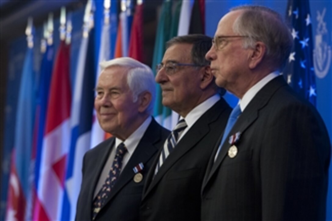 Indiana Sen. Richard Lugar, left, Secretary of Defense Leon E. Panetta, center, and former Georgia Sen. Sam Nunn pose for photographs during a ceremony honoring the senators for their work to help denuclearize countries after the fall of the Soviet Union during a ceremony at the National Defense University in Washington, D.C., on Dec. 3, 2012.   Panetta earlier presented Lugar and Nunn the Defense Department’s highest civilian honor, the Distinguished Public Service Award.  The Cooperative Threat Reduction Program, established in 1991 as part of the Nunn-Lugar Act, is a critical part of the U.S. approach to reducing the threat of proliferation of weapons of mass destruction and related materials.  