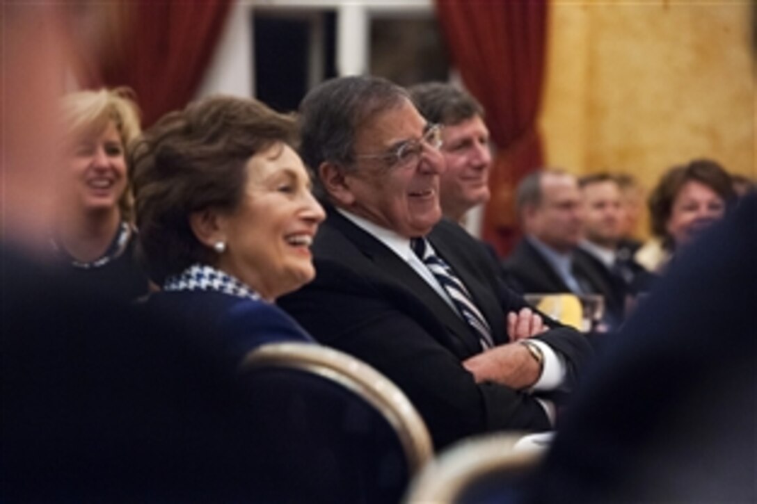Defense Secretary Leon E. Panetta, and his wife, Sylvia, laugh as he is introduced at the Undersecretary of Defense for Intelligence 10th anniversary celebration dinner on Joint Base Myer-Henderson Hall in Arlington, Va., Dec. 3, 2012.
