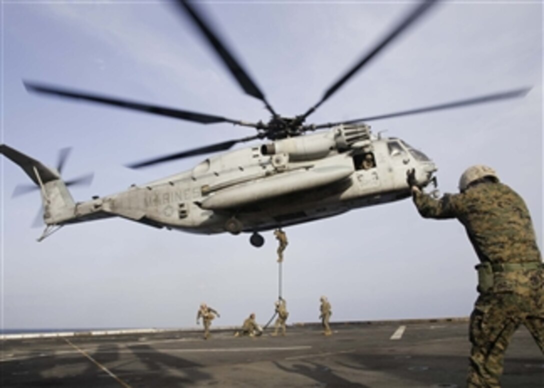 U.S. Marines conduct fast-rope drills from a CH-53E Super Stallion helicopter to the deck of the amphibious transport dock ship USS New York (LPD 21) as the ship operates in the Mediterranean Sea, on Nov. 30, 2012.  The Marines are assigned to the 24th Marine Expeditionary Unit and are embarked onboard the New York as part of the Iwo Jima Amphibious Ready Group.  The group is conducting maritime security operations and theater security cooperation efforts in the U.S. 6th Fleet area of responsibility.  