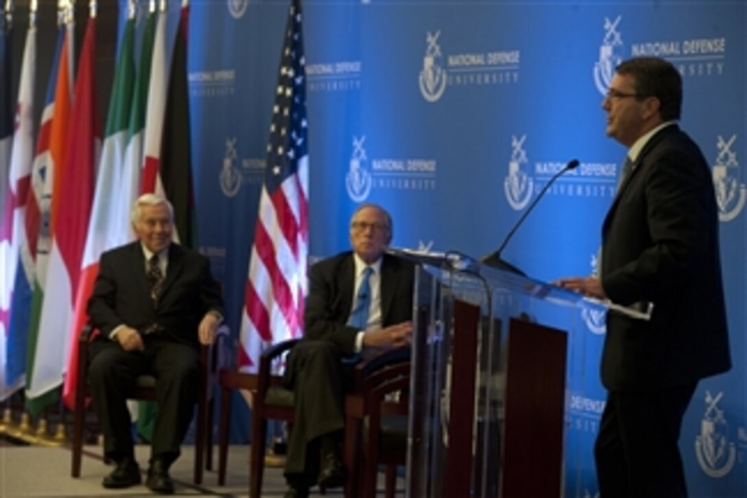 Deputy Secretary of Defense Ashton Carter, right, thanks Indiana Sen. Richard Lugar, left, and former Georgia Sen. Sam Nunn for their work to help denuclearize countries after the fall of the Soviet Union during a ceremony at the National Defense University in Washington, D.C., on Dec. 3, 2012.  The Cooperative Threat Reduction Program, established in 1991 as part of the Nunn-Lugar Act, is a critical part of the U.S. approach to reducing the threat of proliferation of weapons of mass destruction and related materials.  