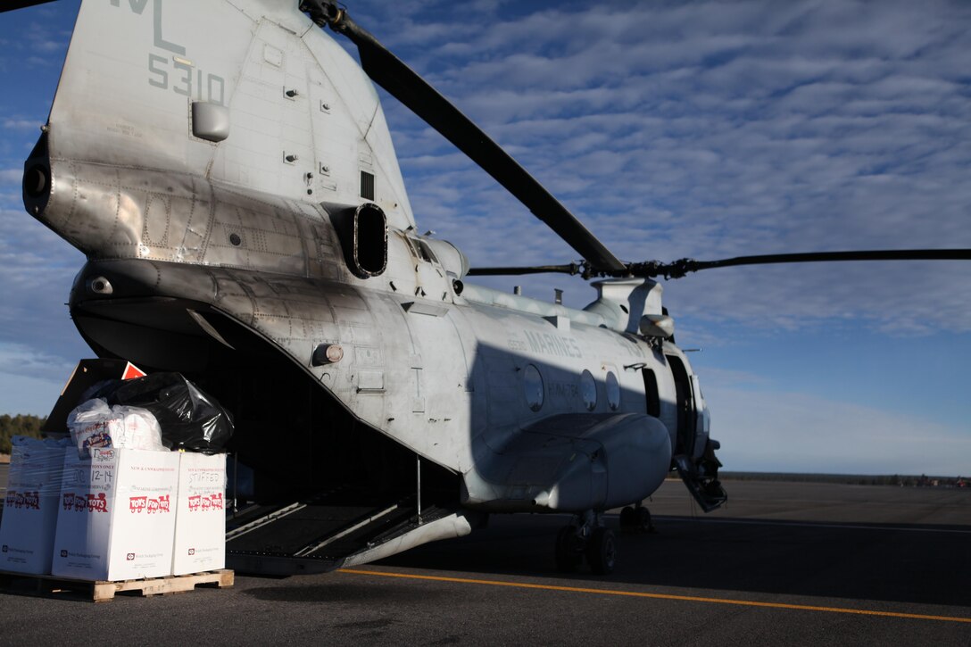 Marines with Marine Medium Helicopter Squadron (HMM) 764 loaded toys gathered by the Flagstaff Toys for Tots organization for more than 175 Havasupai children on Dec. 4, 2012 at the Grand Canyon National Park Airport. They loaded the toys on a CH-46E Sea Knight helicopter and flew through narrow canyons and landed in a confined area in order to deliver the toys on time. (U.S. Marine Corps photo by Cpl. Jessica Ito/Released)