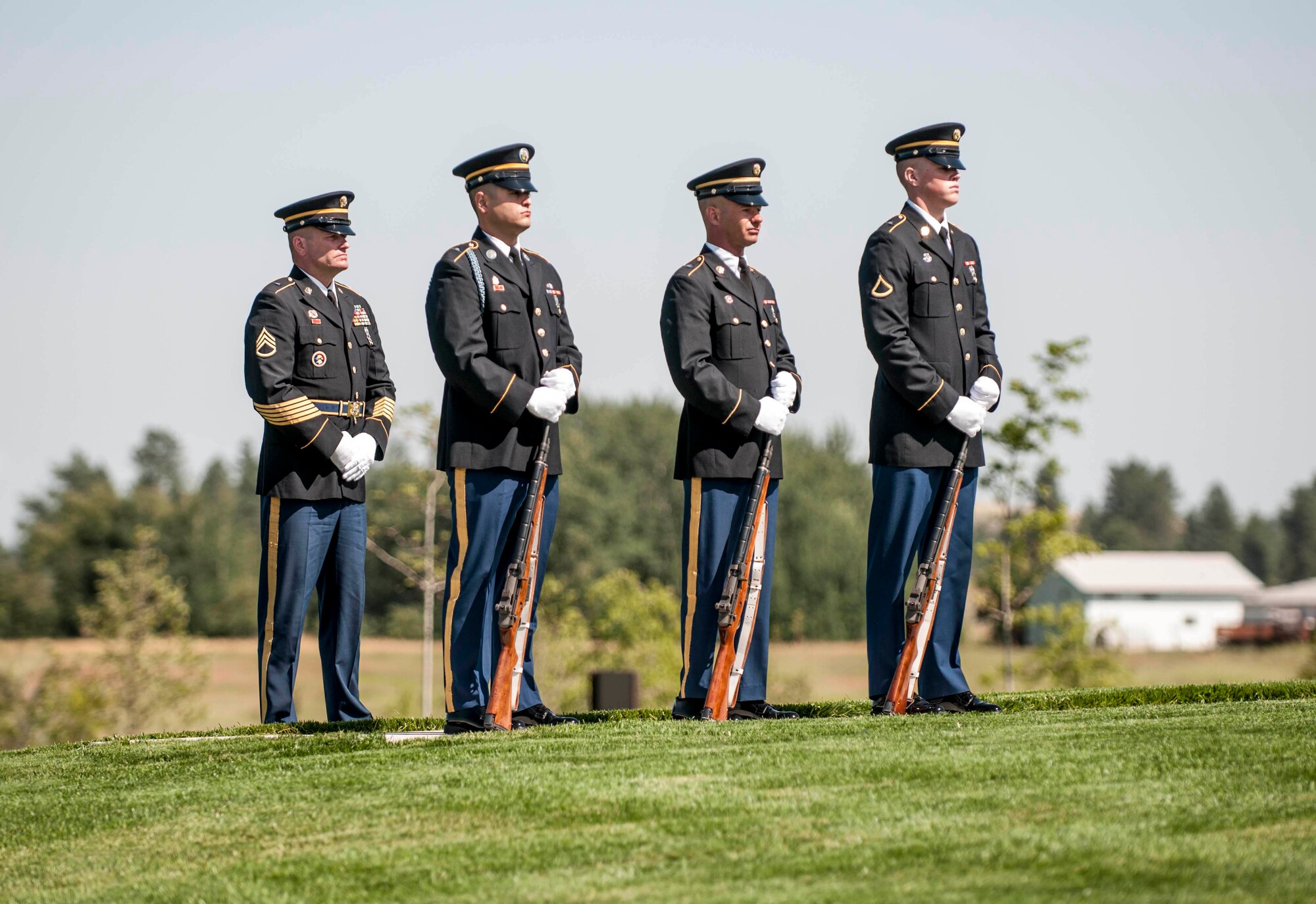 Soldiers from the Washington Army National Guard position themselves for the start of the military honors ceremony held for a fallen Airman at the Washington State Veterans Cemetary in Medical Lake July 30, 2012. (U.S. Air Force photo by Master Sgt. Michael Stewart/Released)