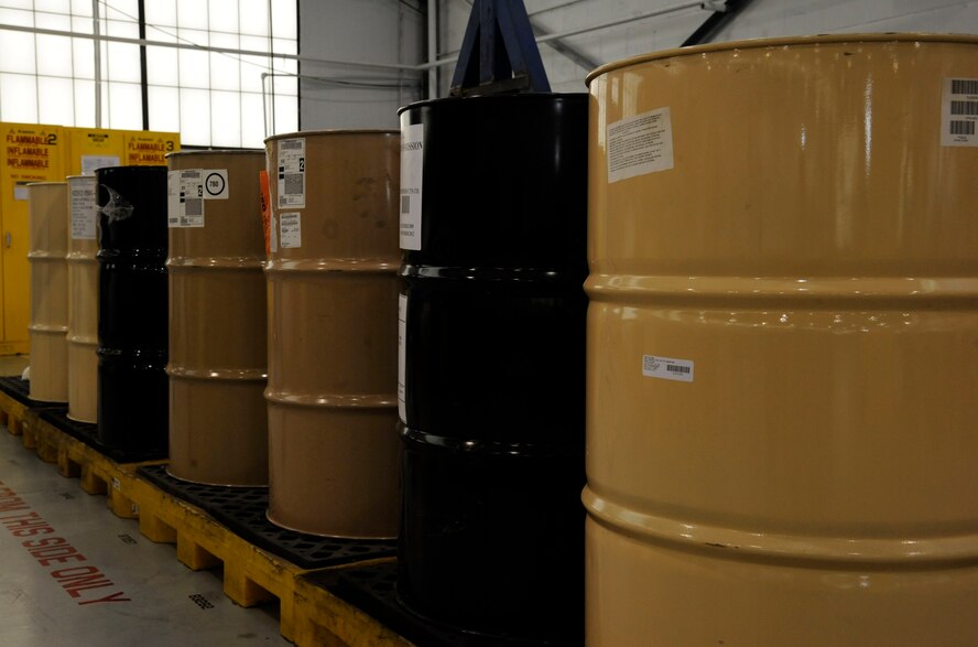 Barrels of gasoline, oil and grease sit in the Aerospace Ground Equipment flight hazardous materials storage on Barksdale Air Force Base, La., Dec. 4. The production control section has the responsibility of monitoring, distributing and disposing of these chemicals for the AGE flight. (U.S. Air Force photo/Airman 1st Class Andrew Moua)(RELEASED)