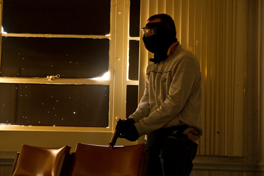 Senior Airman Benjamin Edwards acts as an active shooter during the Anti-Terrorism/Force Protection exercise March 20, 2012 at Joint Base Charleston, S.C. Joint Base Lewis-McChord, Wash., officials announced that a similar exercise will be conducted Dec. 12, 2012 at both Lewis Main and McChord Field. (U.S. Air Force photo/Airman 1st Class George Goslin)