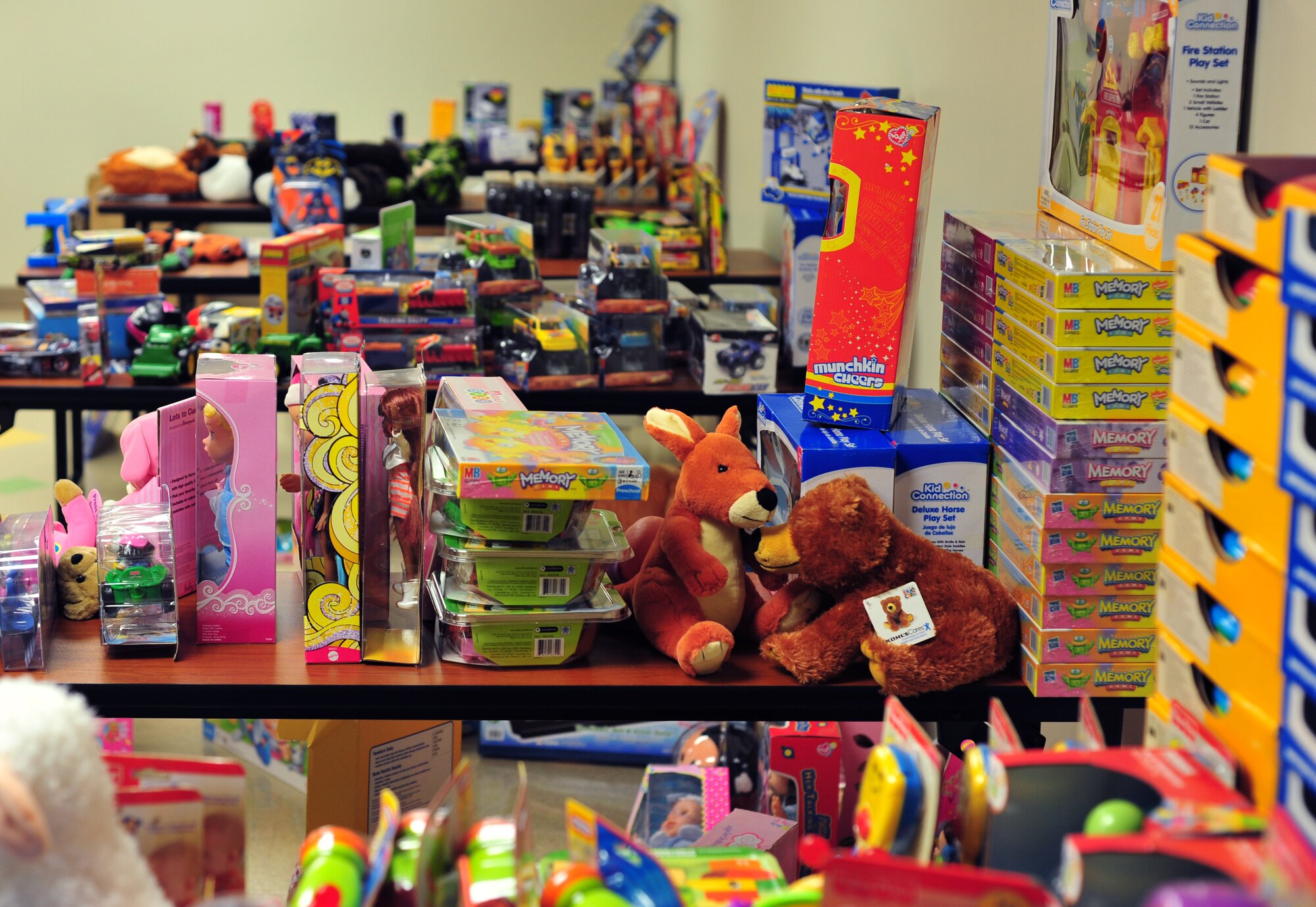 Stacks of toys for various ages sit in Building 338, Dec. 3, 2012, McConnell Air Force Base, Kan. Approximately 400 toys were donated to pass out to Airmen E-5 or below and their families for the annual toy giveaway. The giveaway is from 10:00 a.m. to 2:00 p.m., Dec. 3 to 7, 2012, at Building 338. (U.S. Air Force photo/Airman 1st Class Maurice A. Hodges)
