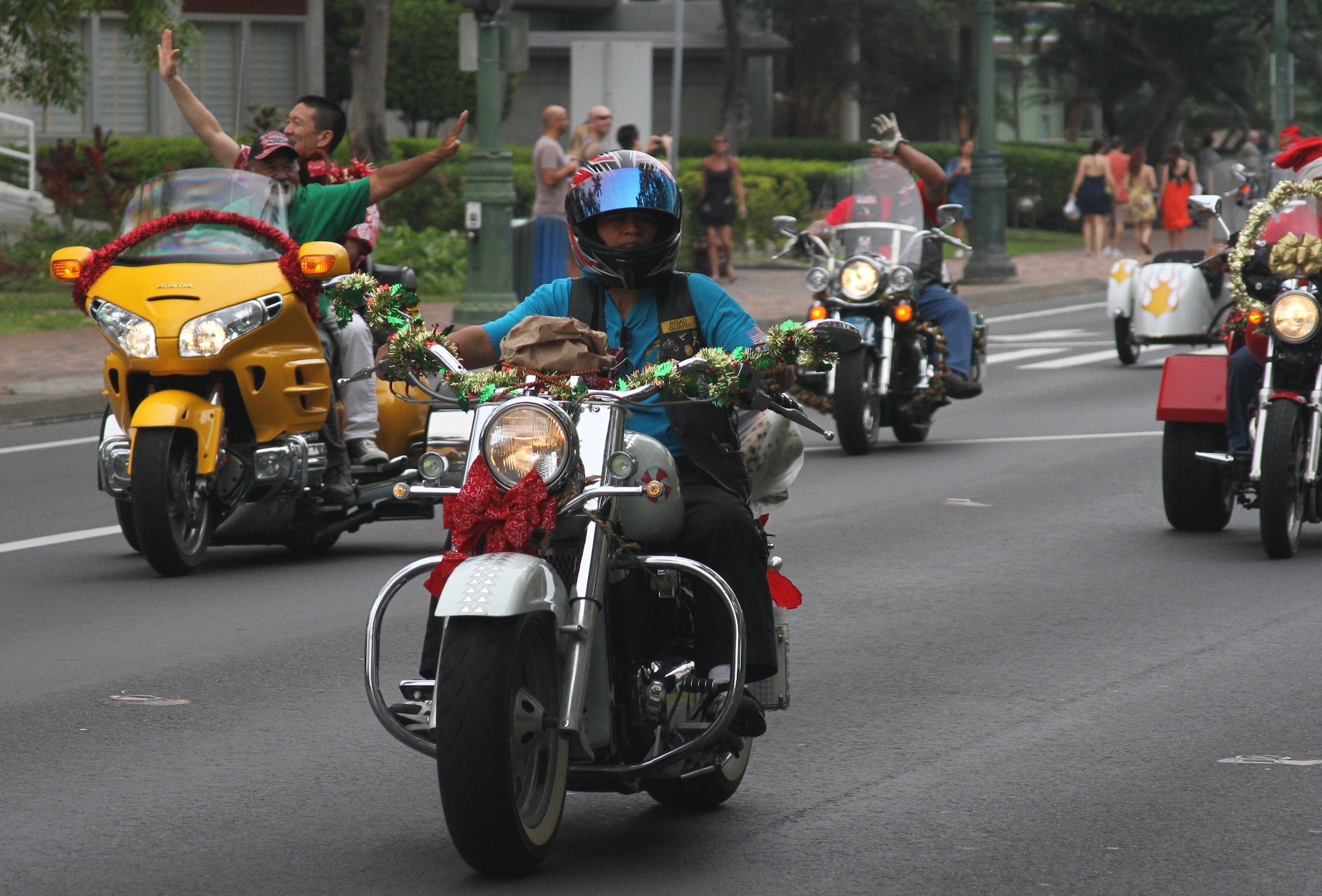 Motorcyclists parade through Oahu Dec. 2 in a display aimed at garnering public support for the annual Toys for Tots campaign. Approximately 6,000 motorcycle enthusiasts gathered in Waikiki for the parade which began at Magic Island and ended at the Kapiolani Community College.  More than 8,000 unwrapped toys were collected for distribution to less fortunate Hawaiian "keiki." (U.S. Air Force photo by Maj. David Eisenbrey)