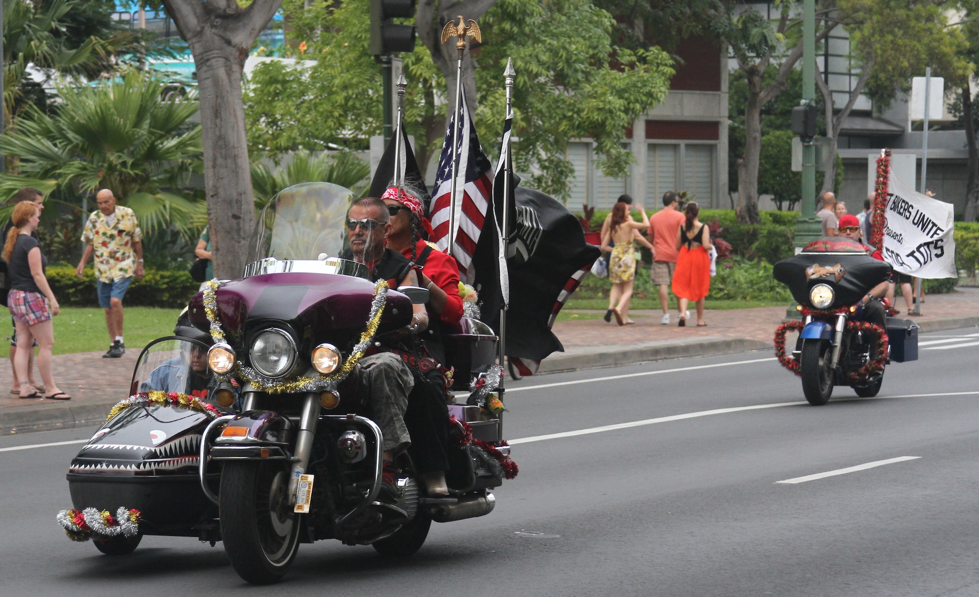 Motorcyclists parade through Oahu Dec. 2 in a display aimed at garnering public support for the annual Toys for Tots campaign. Approximately 6,000 motorcycle enthusiasts gathered in Waikiki for the parade which began at Magic Island and ended at the Kapiolani Community College.  More than 8,000 unwrapped toys were collected for distribution to less fortunate Hawaiian "keiki." (U.S. Air Force photo by Maj. David Eisenbrey)