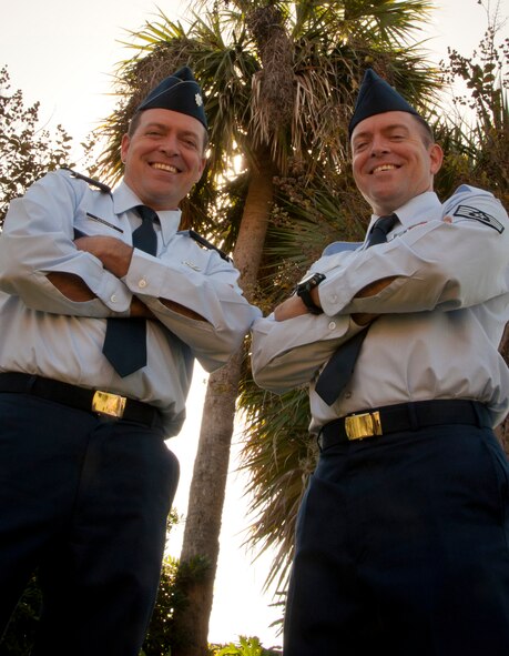 MACDILL AIR FORCE BASE, Fla. –When Lt. Col. Wilton Addison, left, the commander of the 159th Civil Engineer Squadron at Naval Air Station Joint-Reserve Base, New Orleans and his twin brother, found out his twin brother, Staff Sgt. Milton Addison, right, , a knowledge operations apprentice with the 927th Force Support Squadron, was being promoted, he had to travel the country to attend the ceremony.  The twins differ in rank but share a dedication to serve together in the U.S. Air Force. (Official U.S. Air Force photo/Staff Sgt. Shawn Rhodes)  
