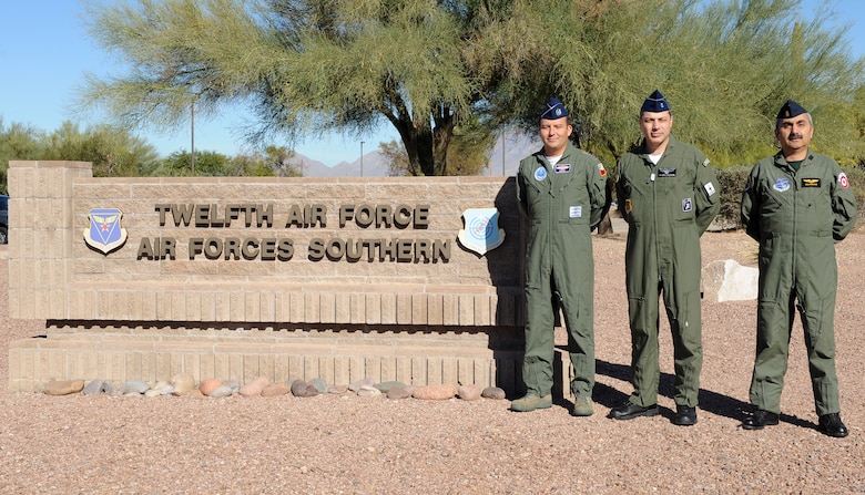 Chilean Air Force Col. Cristian Eguia, Brazilian Air Force Col. Paulo Vasconcellos, and Peruvian Air Force Col. Marcos Huaman, 12th Air Force (Air Forces Southern) liaison officers stand next to the sign outside of the 12th Air Force (AFSOUTH) building on Davis-Monthan Air Force Base, Ariz., Nov. 30. An LNO represents their respective Air Force in the United States. They are the main link for Southern Command and their respective Air Forces in their countries. Part of their job is to help build the partnership between the two Air Forces so we can work together. (U.S. Air Force photo by Senior Airman Brittany Dowdle) 