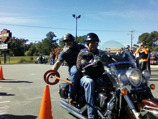 (Left) Ray Sagan, from the 437th Maintenance Squadron and Scott Olson, both Chapter 37 Green Knights members, participate in a jousting competition during the Knights of the Round Table Tournament Oct. 17, 2012, at Outer Banks, N.C. The Green Knights won this year’s tournament earning the rights to host next year’s event held Oct. 17-20, 2013, at the Short Stay Naval Recreation Area in Moncks Corner, S.C. The Knights of the Round Table Tournament is an annual motorcycle challenge between the Blue Knights Law Enforcement Motorcycle Club, the Green Knights Military Motorcycle Club and the Red Knights fire department, and consists of a motorcycle jousting competition, obstacles courses, a slowest and fastest rider contest and many more activities. The Green Knights’ mission is to address the needs and concerns of the military and DOD civilian riders, through education, safety knowledge and the shared joy of riding.  (Courtesy photo)