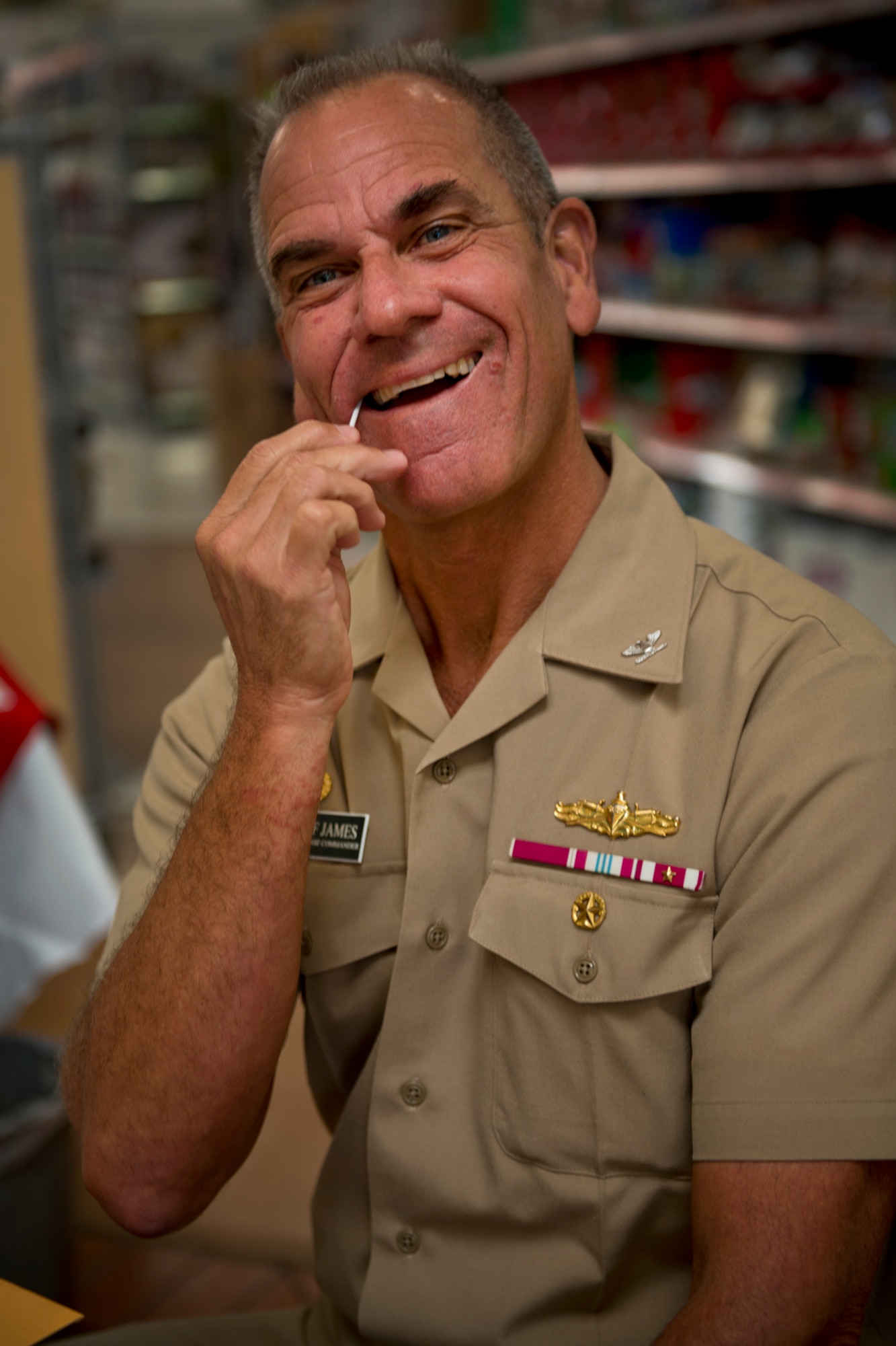U.S. Navy Capt. Jeff James, Joint Base Pearl Harbor-Hickam commander, swabs his mouth with cotton to collect samples of their DNA for the C.W. Bill Young Department of Defense Bone Marrow Donor Program Nov. 29, 2012, at the Hickam Field Base Exchange. Since the creation of the National Marrow Donor Program in 1986, more than six million Americans, including more than 400,000 service members, have registered as marrow donors. According to the website, there is a particularly urgent need for minority donors, but anyone in good health between the ages of 18 and 60 is welcomed. As of April 30, 2012, there were 9,997,044 registered donors in the National database. To learn more, visit the website at www.dodmarrow.org. (U.S. Air Force photo/Staff Sgt. Mike Meares)
