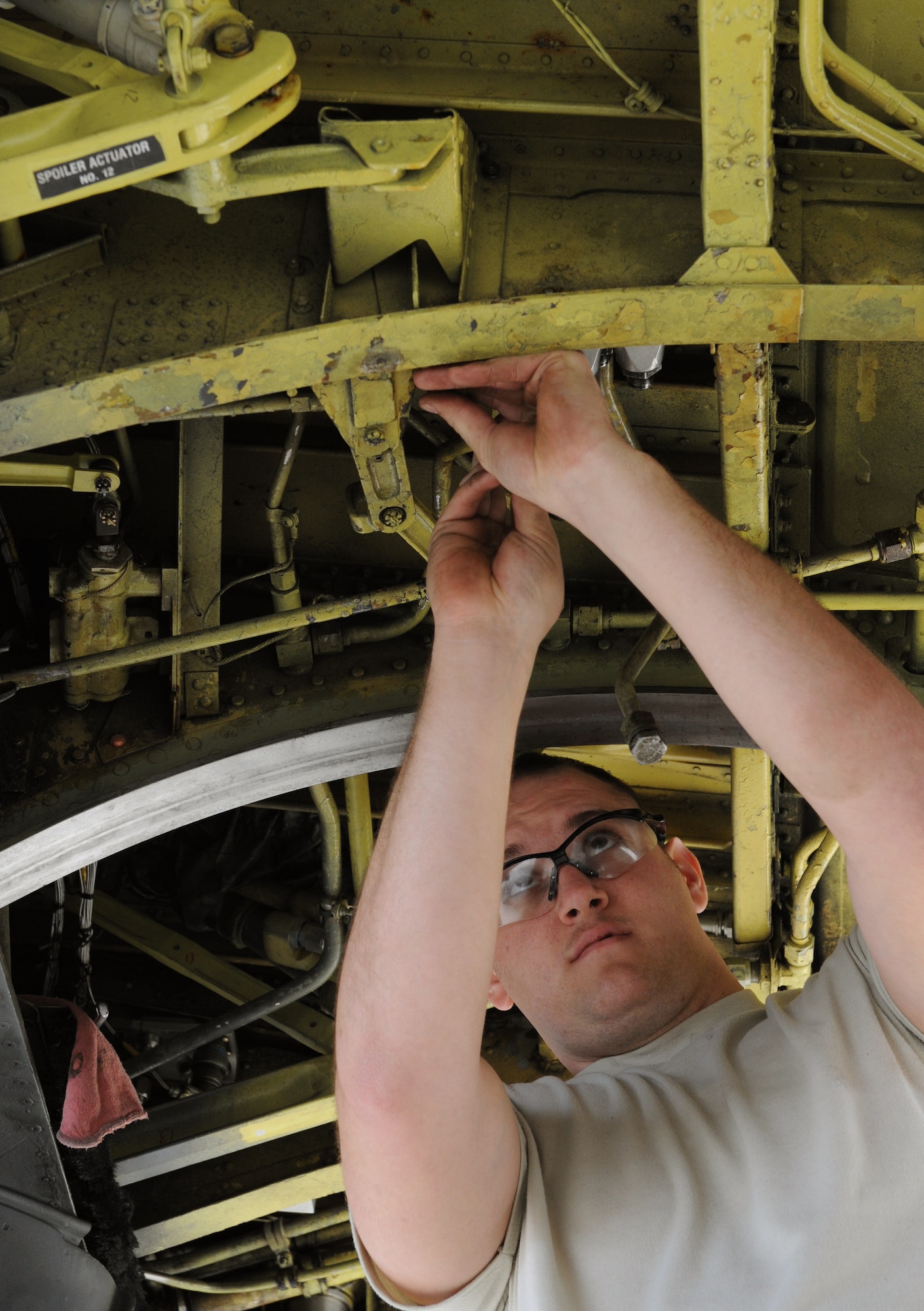Senior Airman Tobi Bennett, 20th Aircraft Maintenance Unit hydraulics technician, reinstalls a spoiler metering valve on a B-52H Stratofortress on Barksdale Air Force Base, La., Dec. 5. The spoiler metering valve allows the B-52 flight controls to perform aerial maneuvers. The long range and versatility of the B-52 make it the weapon of choice for providing deterrence, demonstrating U.S. resolve and combat operations around the world. (U.S. Air Force photo/Airman 1st Class Benjamin Gonsier)
