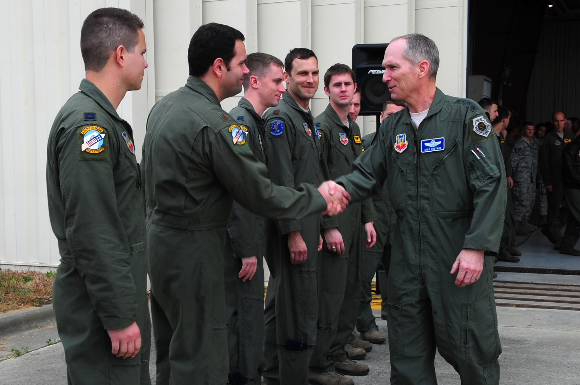 U.S. Air Force Gen. Mike Hostage, Commander, Air Combat Command, shakes hands with an aircrew member during his visit to Seymour Johnson Air Force Base, N.C., Dec. 4, 2012. Hostage thanked the recently deployed Airmen for their service in the Middle East. (U.S. Air Force photo/Airman 1st Class Aubrey White/Released)