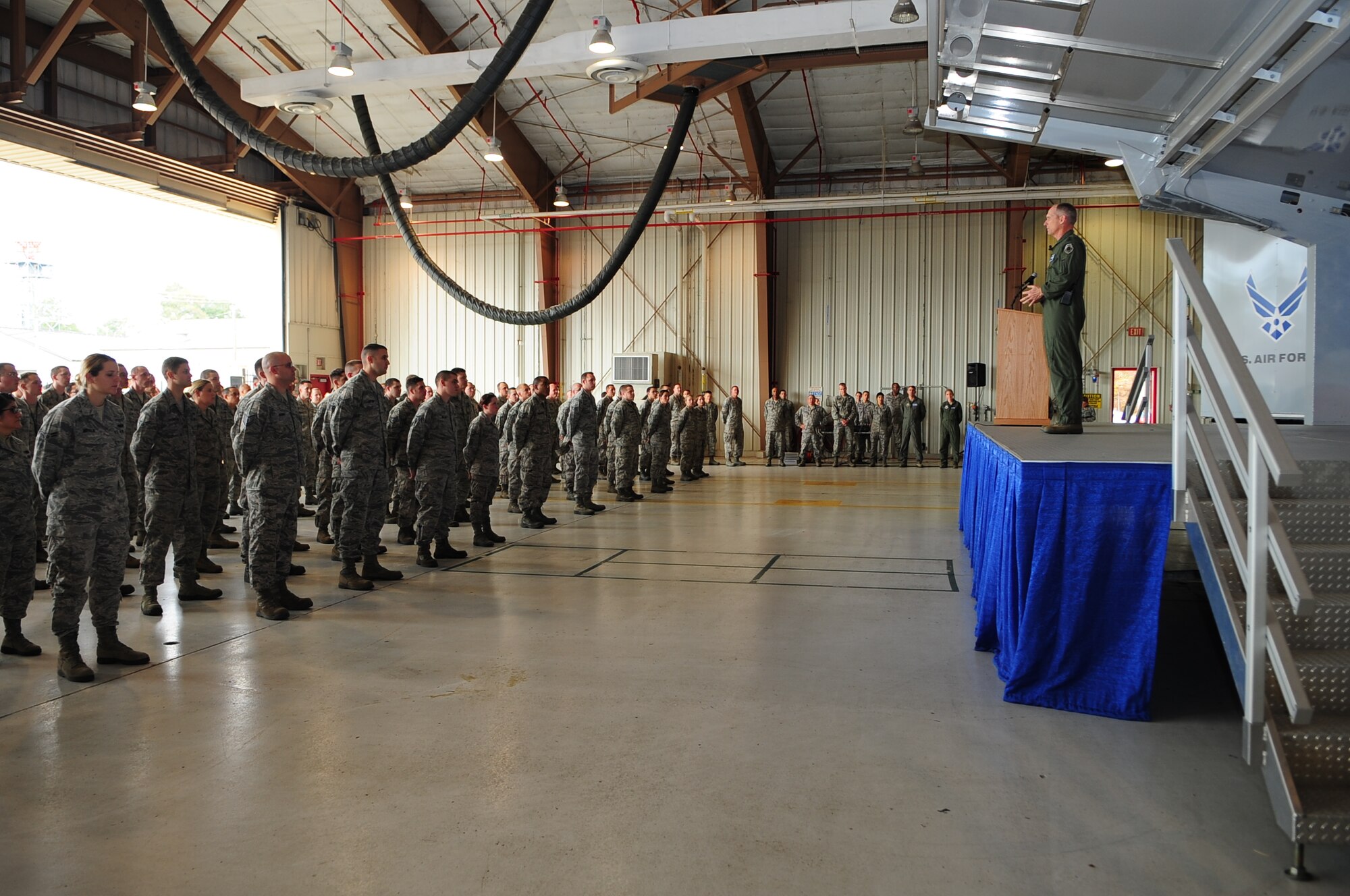 U.S. Air Force Gen. Mike Hostage, Commander, Air Combat Command, speaks to members of the 4th Fighter Wing during a visit to Seymour Johnson Air Force Base, N.C., Dec. 4, 2012. Hostage covered several topics including the future of military retirements and combat operations. (U.S. Air Force photo/Airman 1st Class Aubrey White/Released)