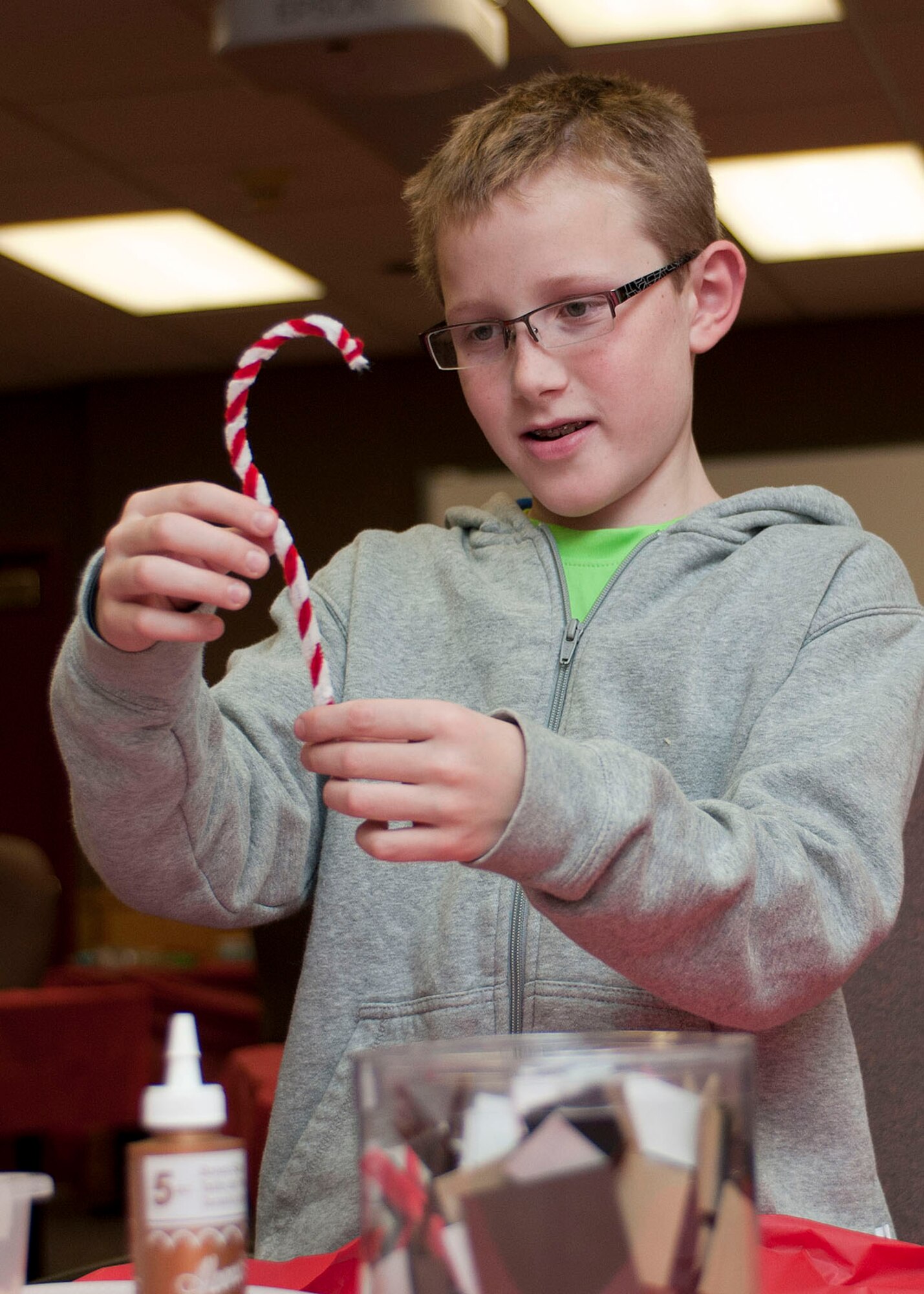 HANSHANSCOM AIR FORCE BASE, Mass. -- Sean Moss makes a holiday ornament at the Airman and Family Readiness Center Nov. 28 during a Family Holiday Craft Workshop. Parents and children were invited to make special handcrafted ornaments for the holidays. (U.S. Air Force photo by Mark Wyatt)